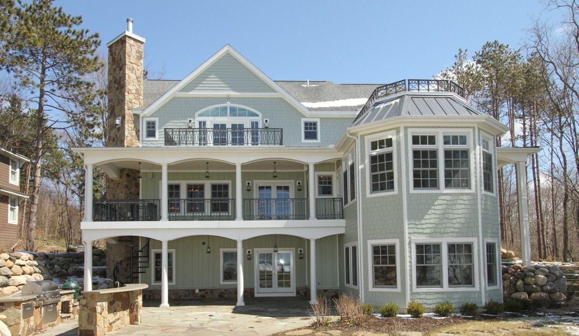 A large house with a lot of windows and balconies
