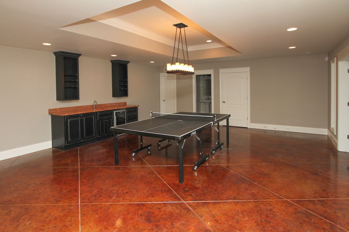 There is a ping pong table in the middle of the room.
