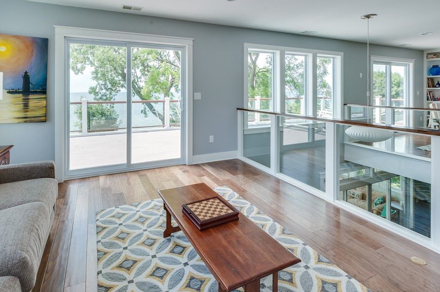 A living room with a wooden coffee table and a chess board on it.