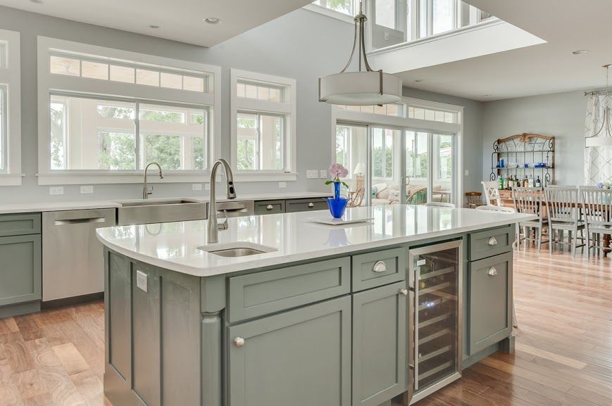 There is a large island in the middle of the kitchen.