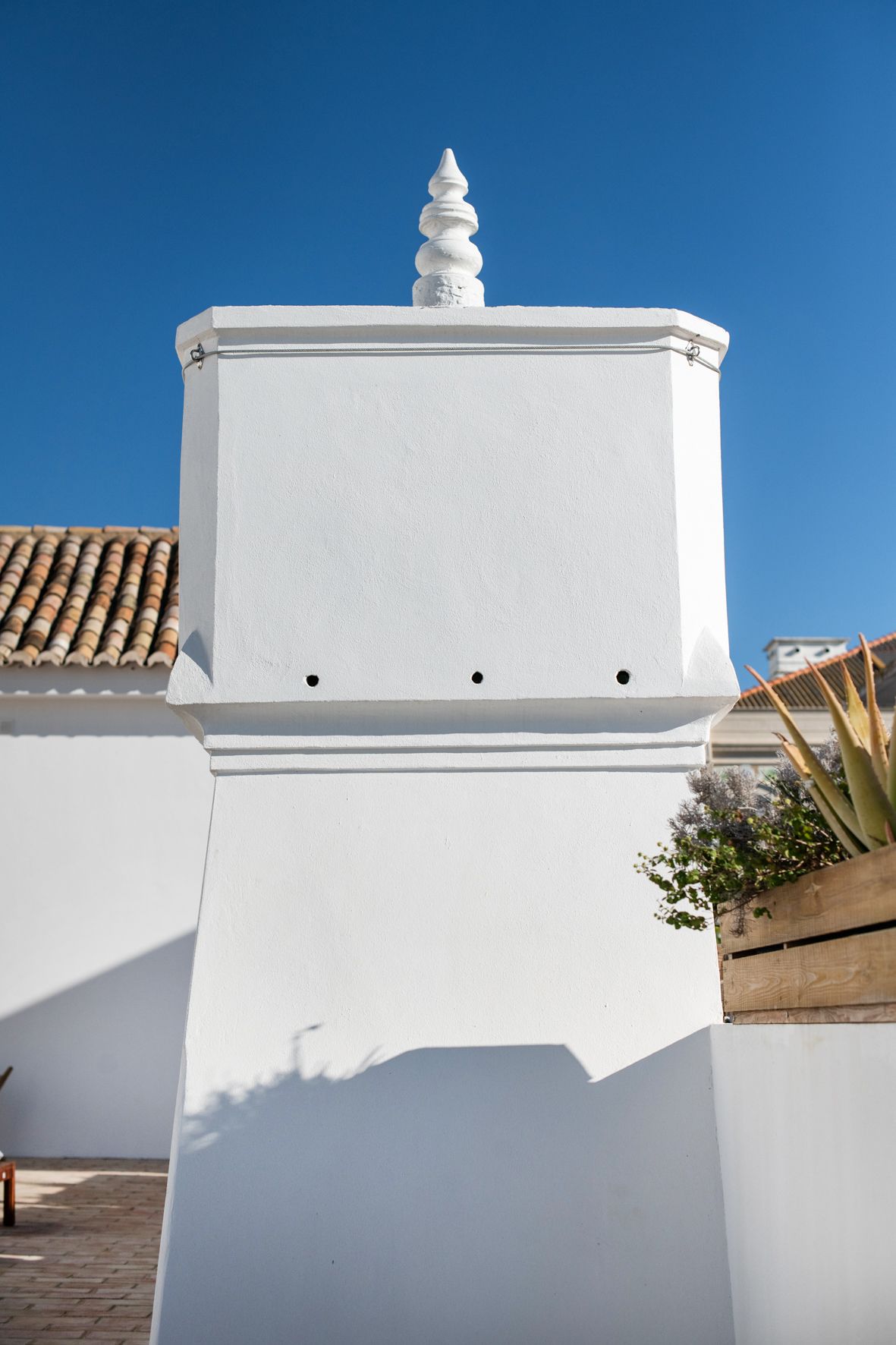 a white building with a blue sky in the background