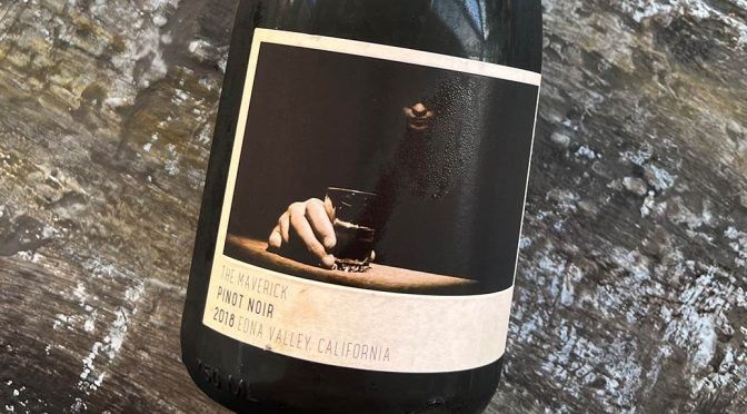 A person is holding a can of sun cruiser beer in a cooler filled with ice.