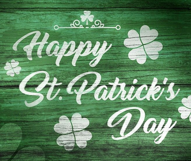 Happy St. Patrick's Day graphic on green wooden background with shamrocks and decorative elements.