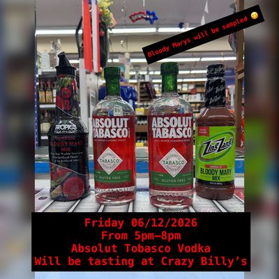 Liquor display with Absolut and Taaka vodka bottles; sign advertises Friday tasting at Billy's.