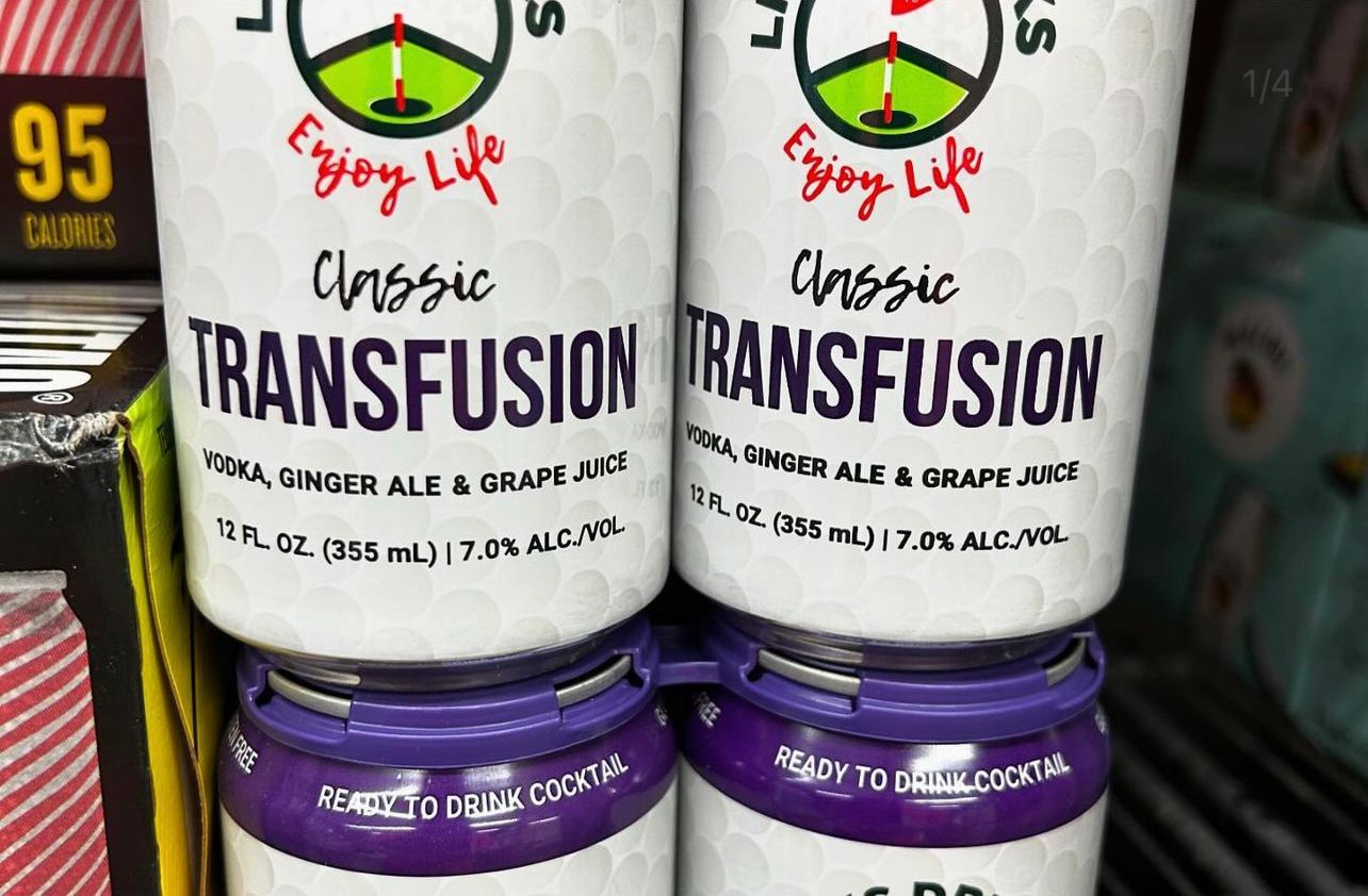 Two cans of classic transfusion are stacked on top of each other on a shelf.