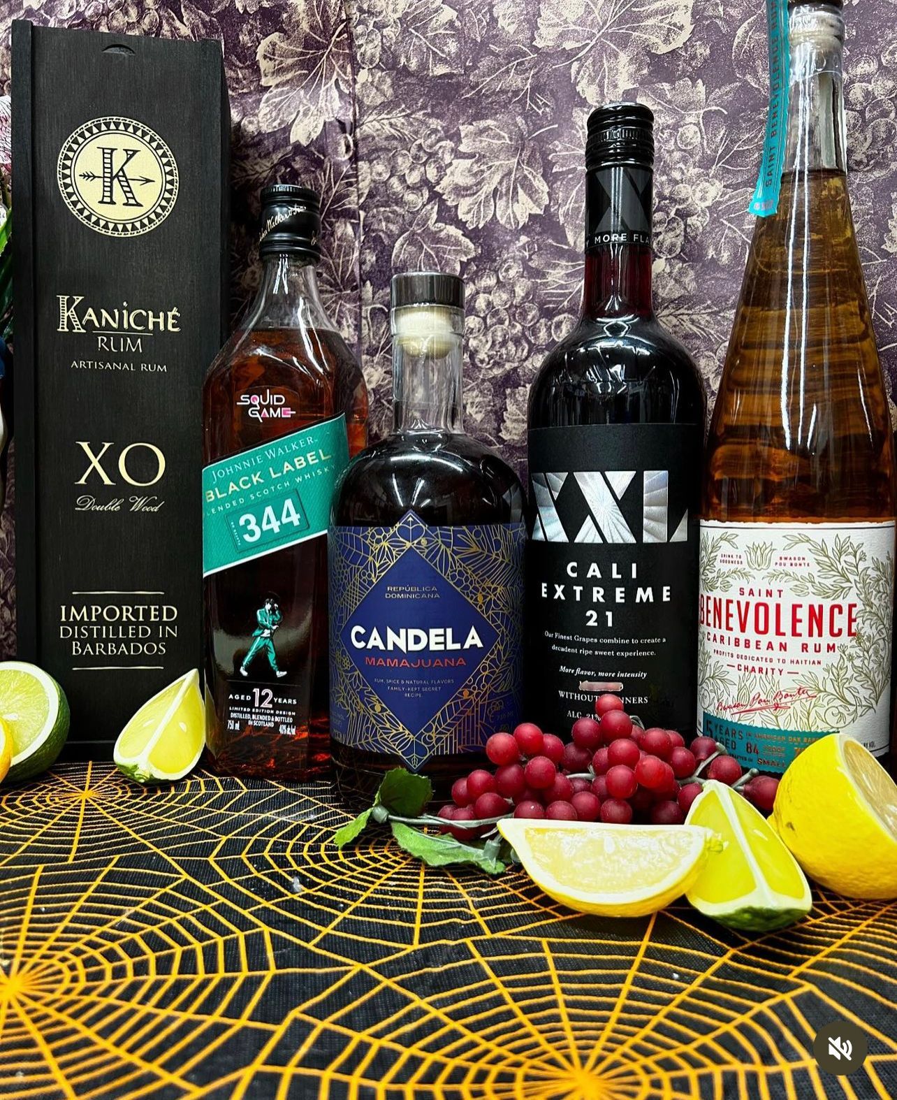 A group of bottles of alcohol are sitting on a table.