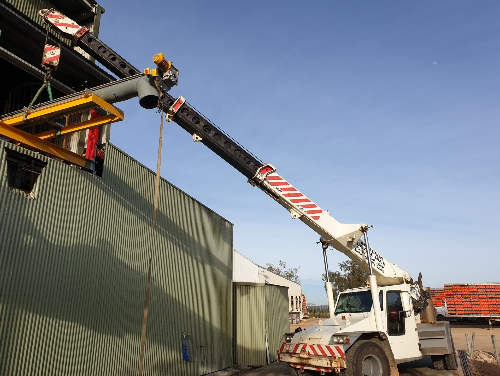 Mobile Crane At Construction Site — Mareeba Crane Hire in Mareeba, QLD