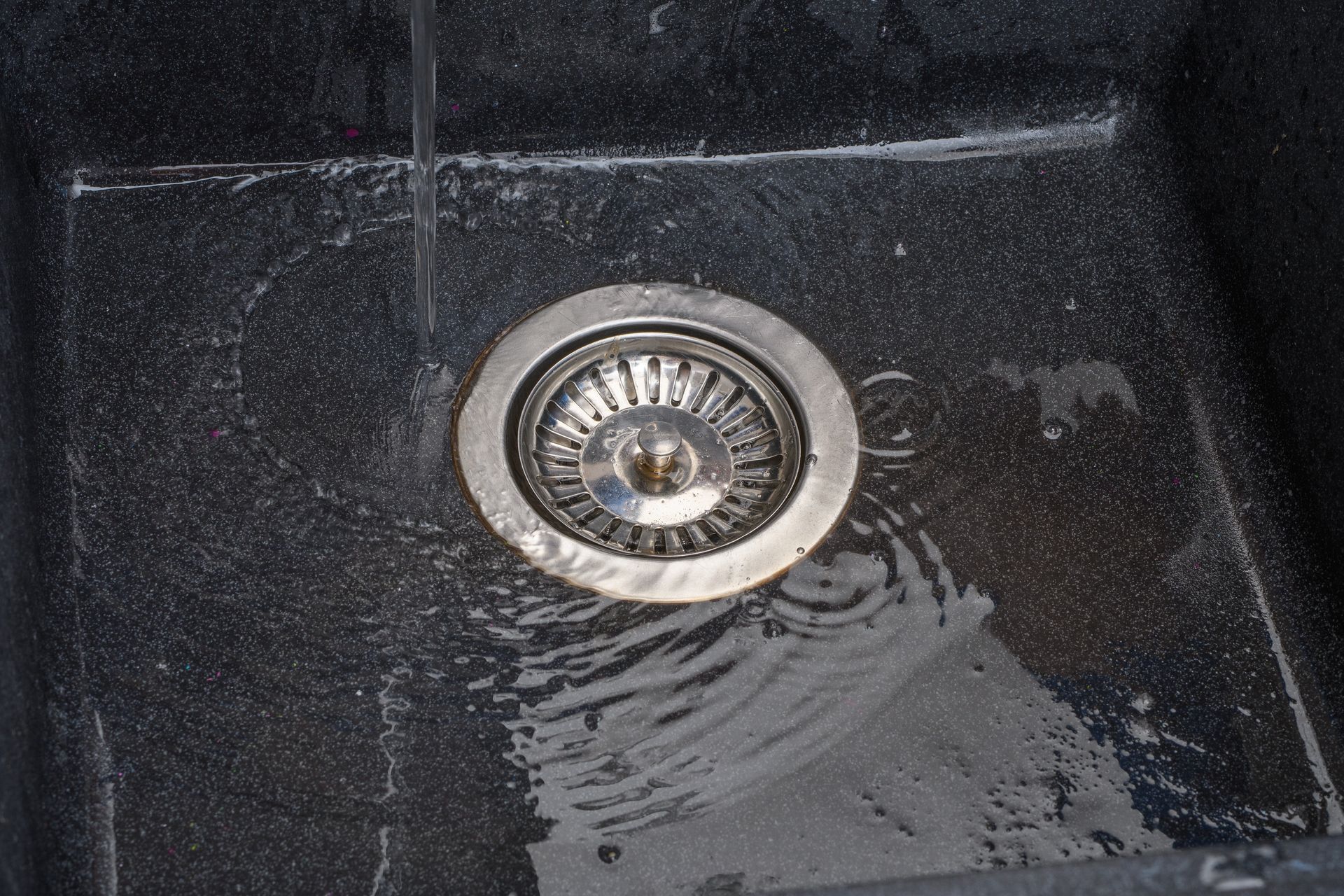 Close-up of a Black Sink With a Metallic Drain — Oxplumb in Buderim, QLD