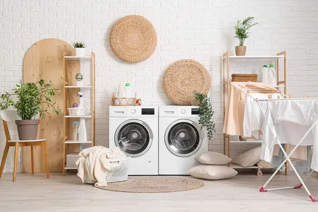 A Bright Laundry Room with Two White Front Loading Machines — Central Coast Washing Machines & Refrigerator Repairs in Gosford, NSW