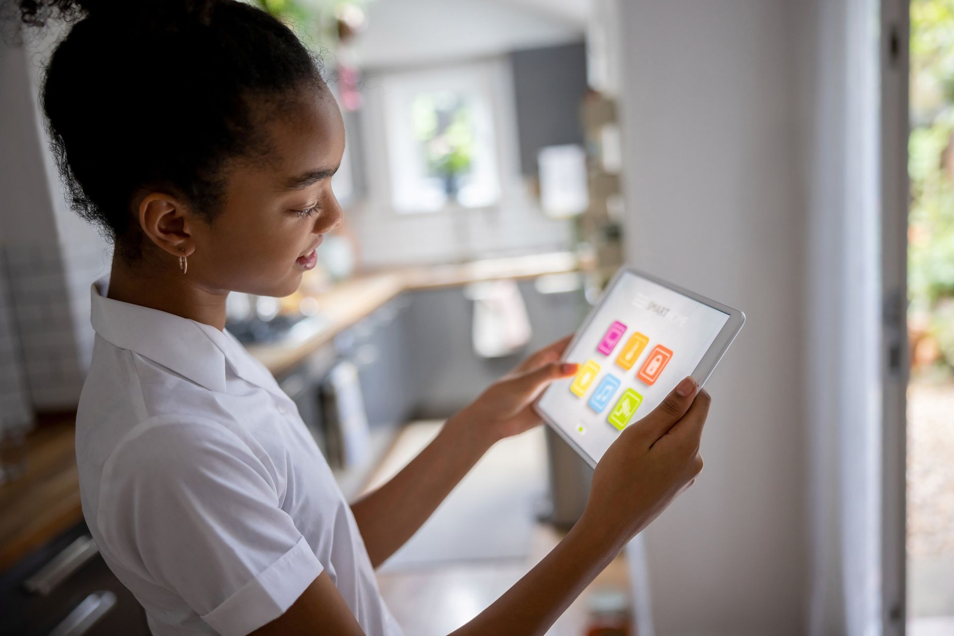 A Young Girl Is Using a Tablet — Gold Coast, Qld — Australian Security Company