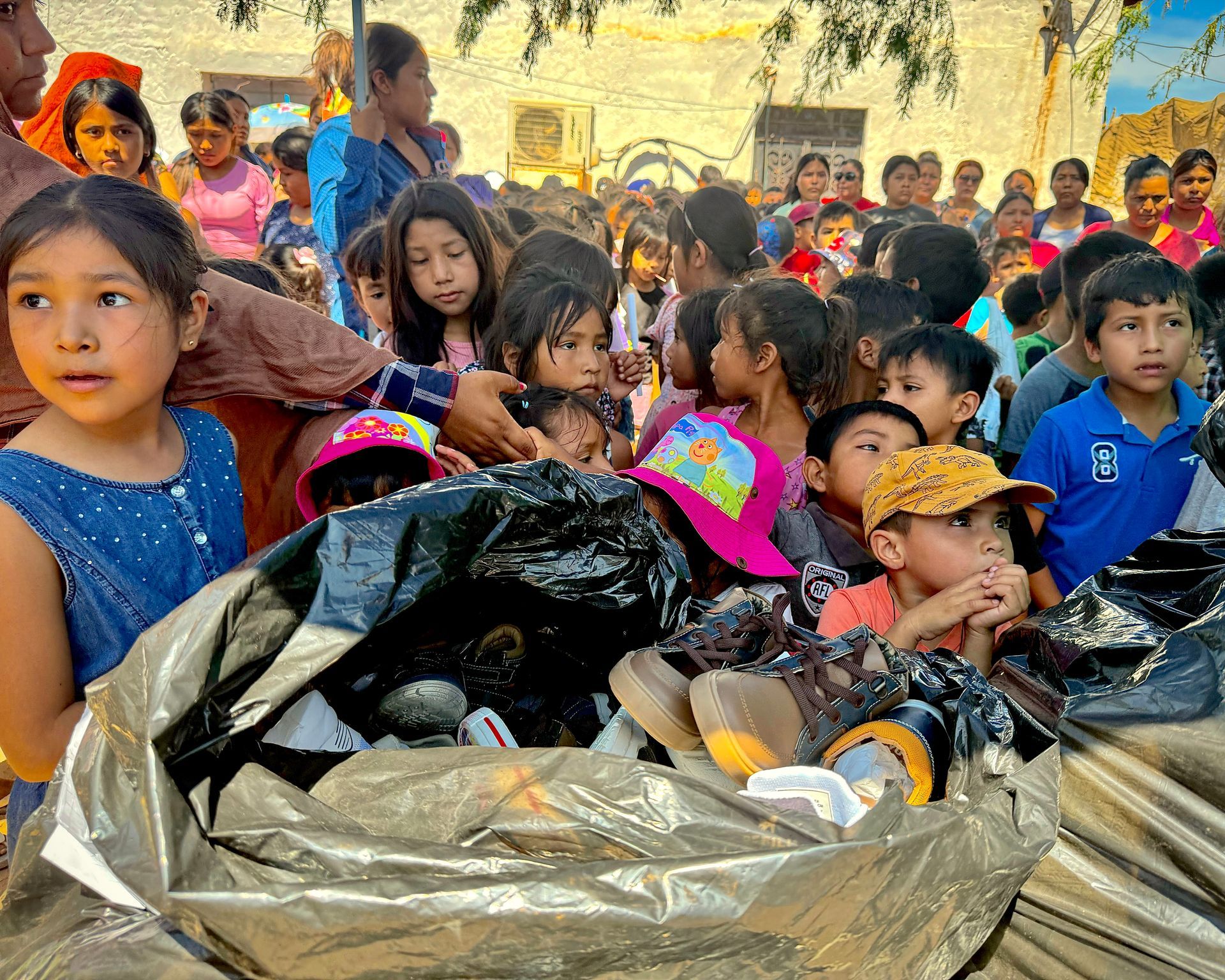 Children are waiting for their new shoes.