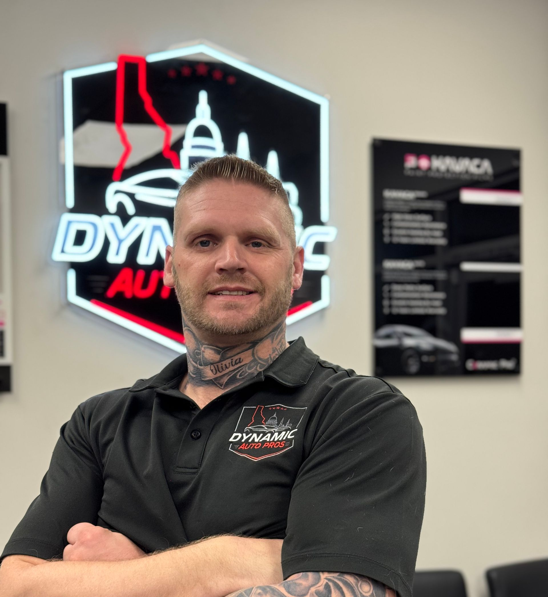 A silver sports car is parked in a garage.