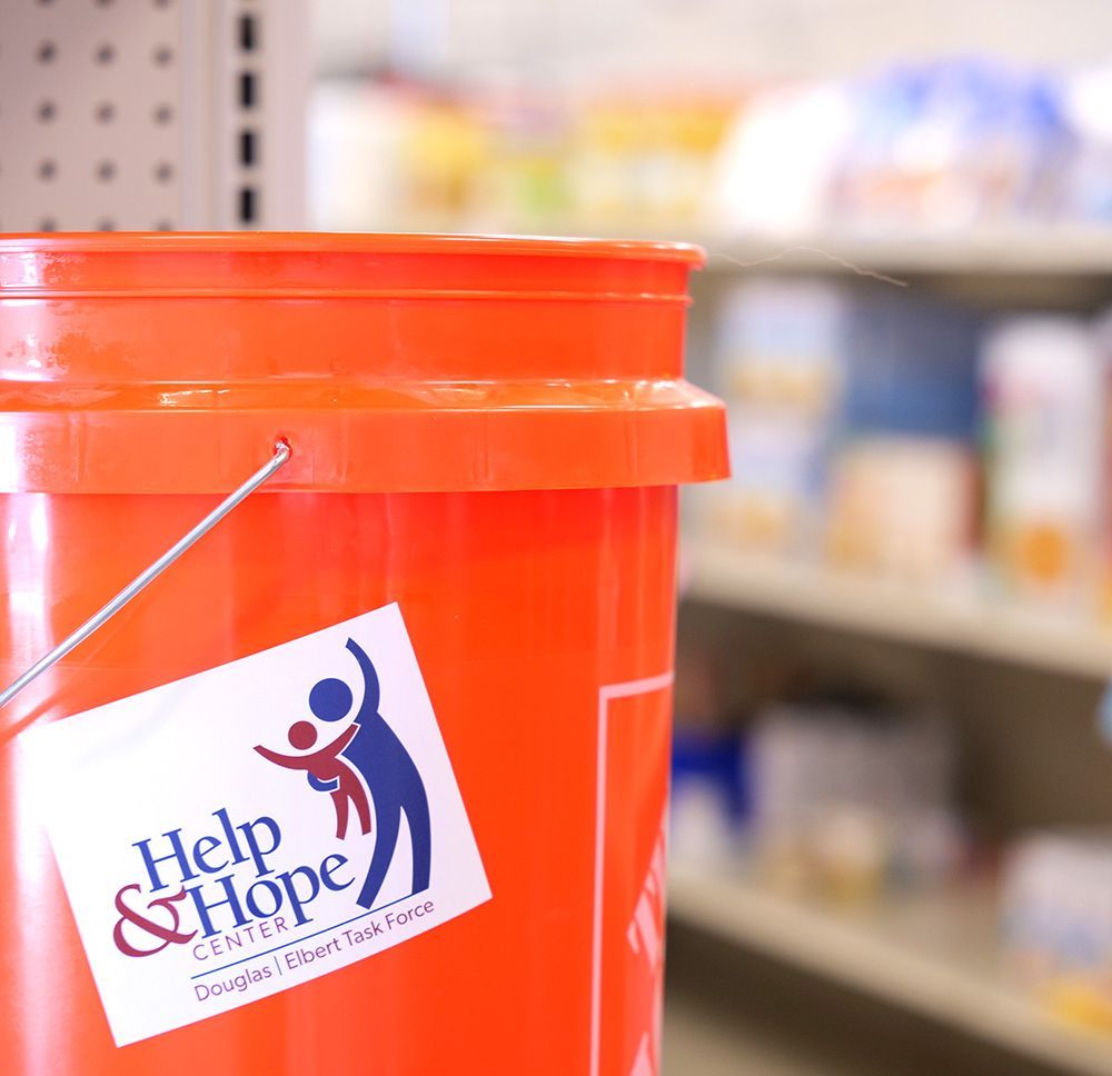 An orange bucket for Help & Hope Center's Buckets of Hope