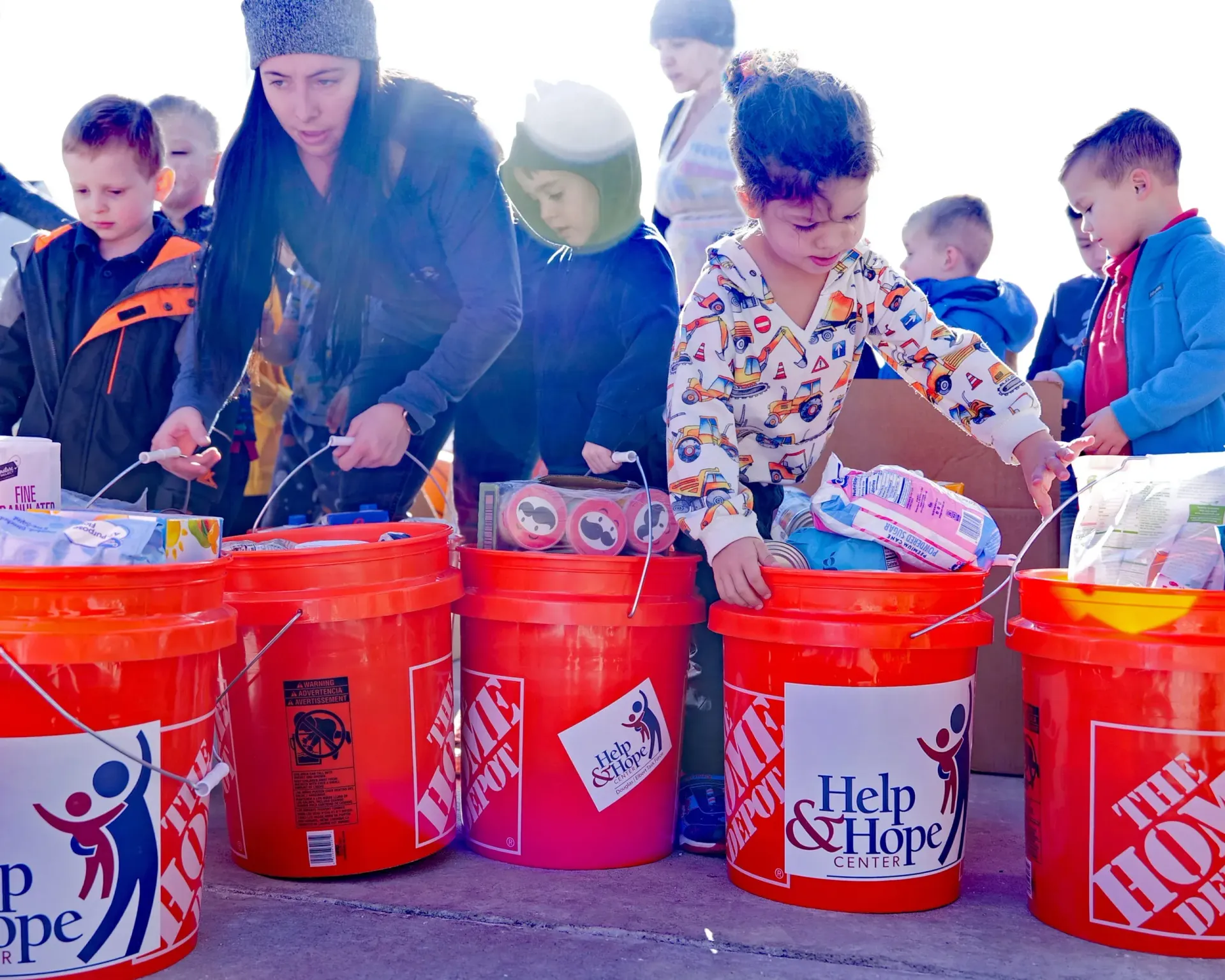 A group of children support Help & Hope Center's Food Drive