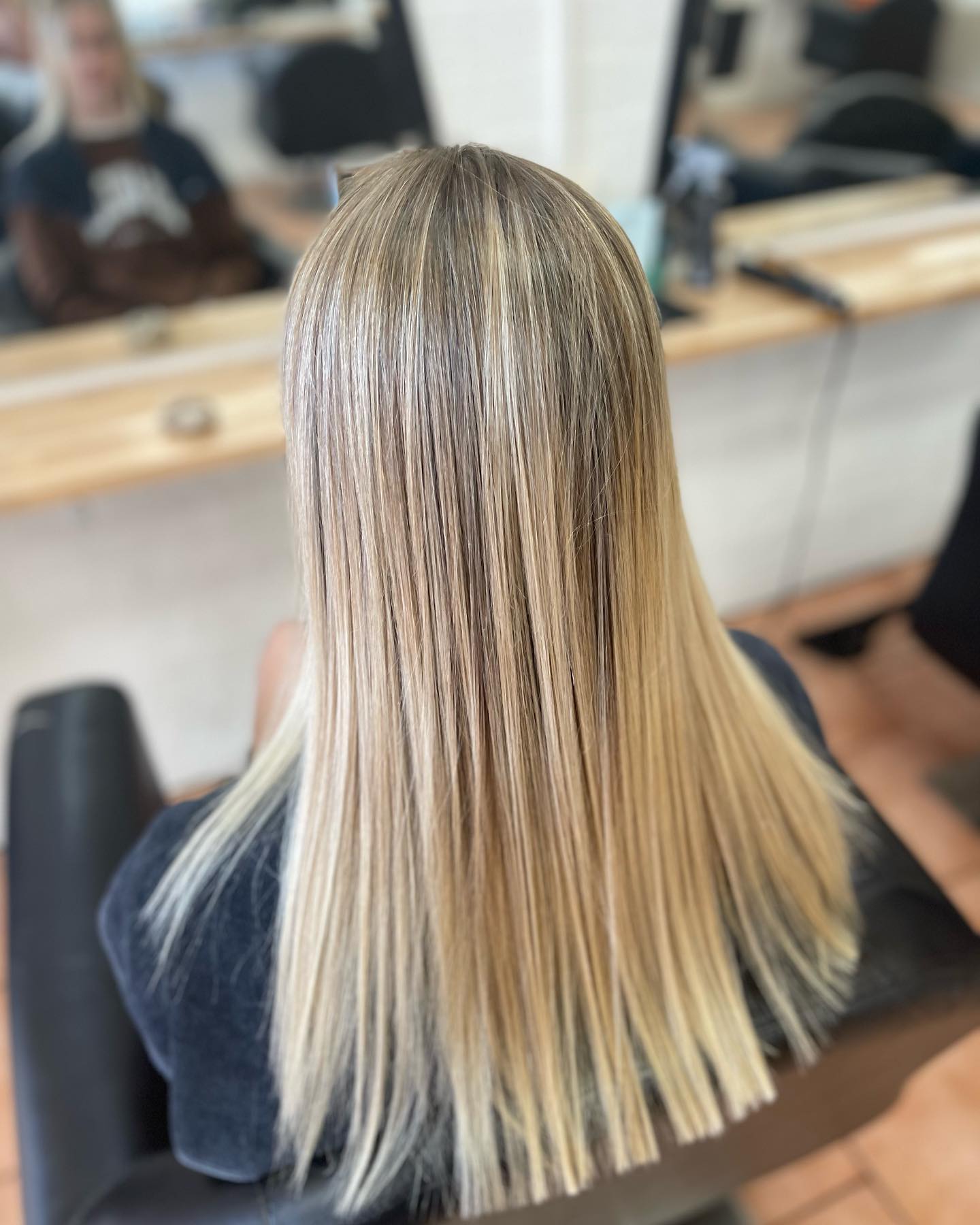 Professional Hairdresser Dyeing Hair of Her Client — Local Hair Salon In Unanderra