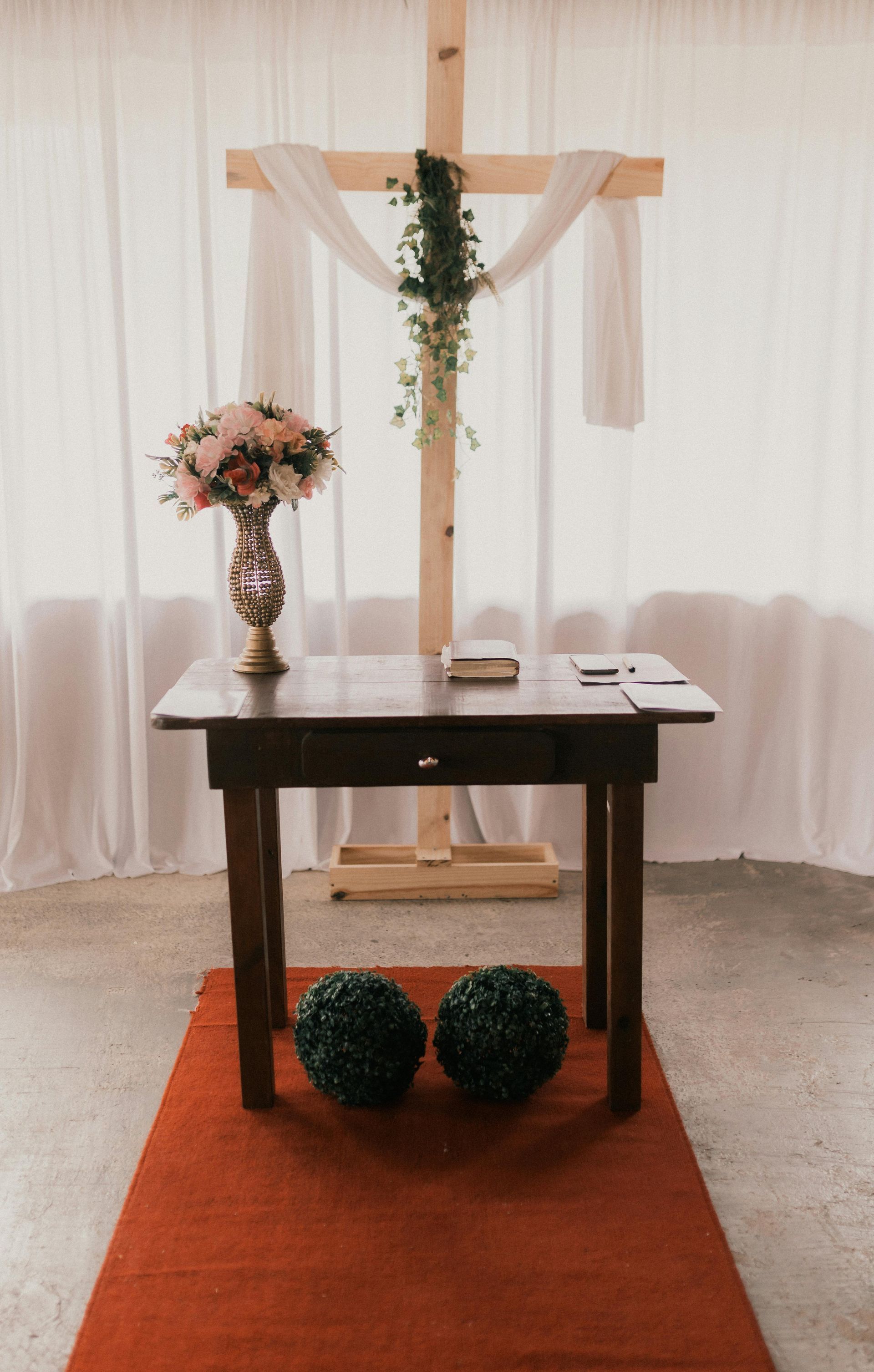 There is a wooden cross in the middle of the room.