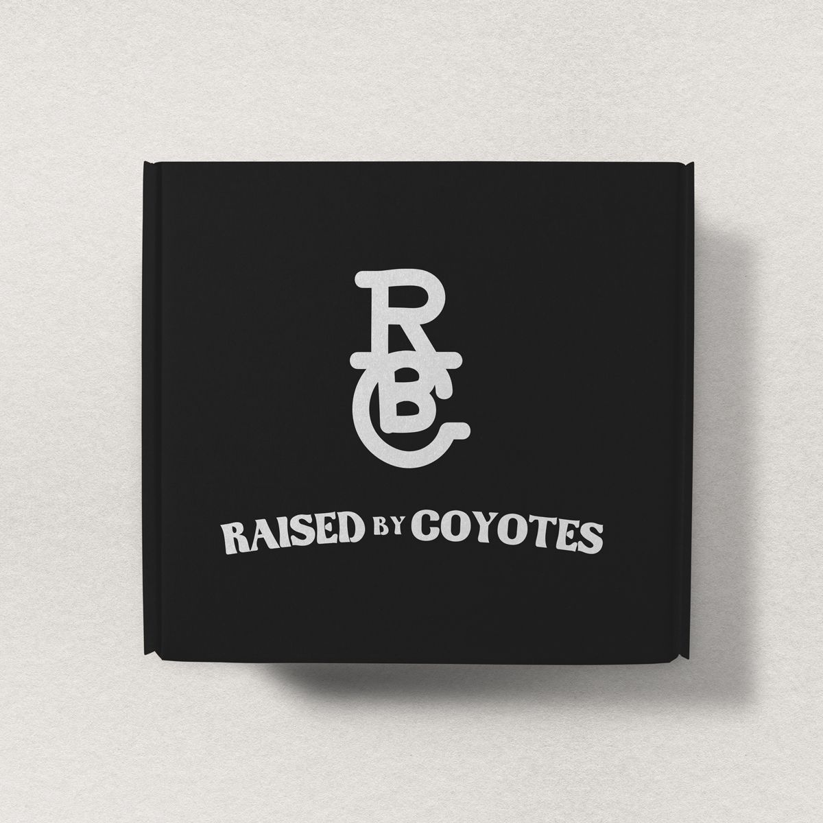 Raised by Coyotes logo