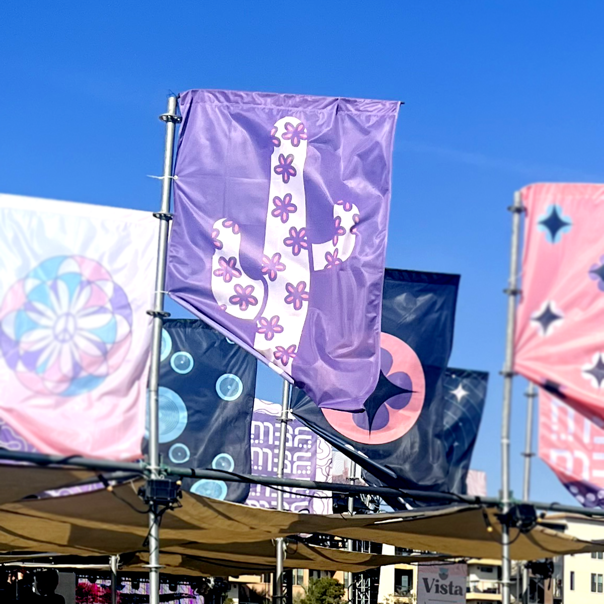 A row of flags with one that says vista on it