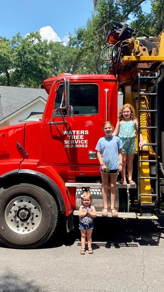 Three Girls Standing on a Truck — Savannah, GA — Waters Tree Service