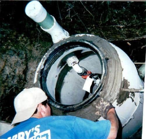 A man wearing a blue shirt that says ' dry 's ' on it