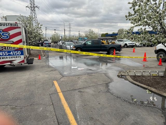 A truck that says industrial is parked in a parking lot