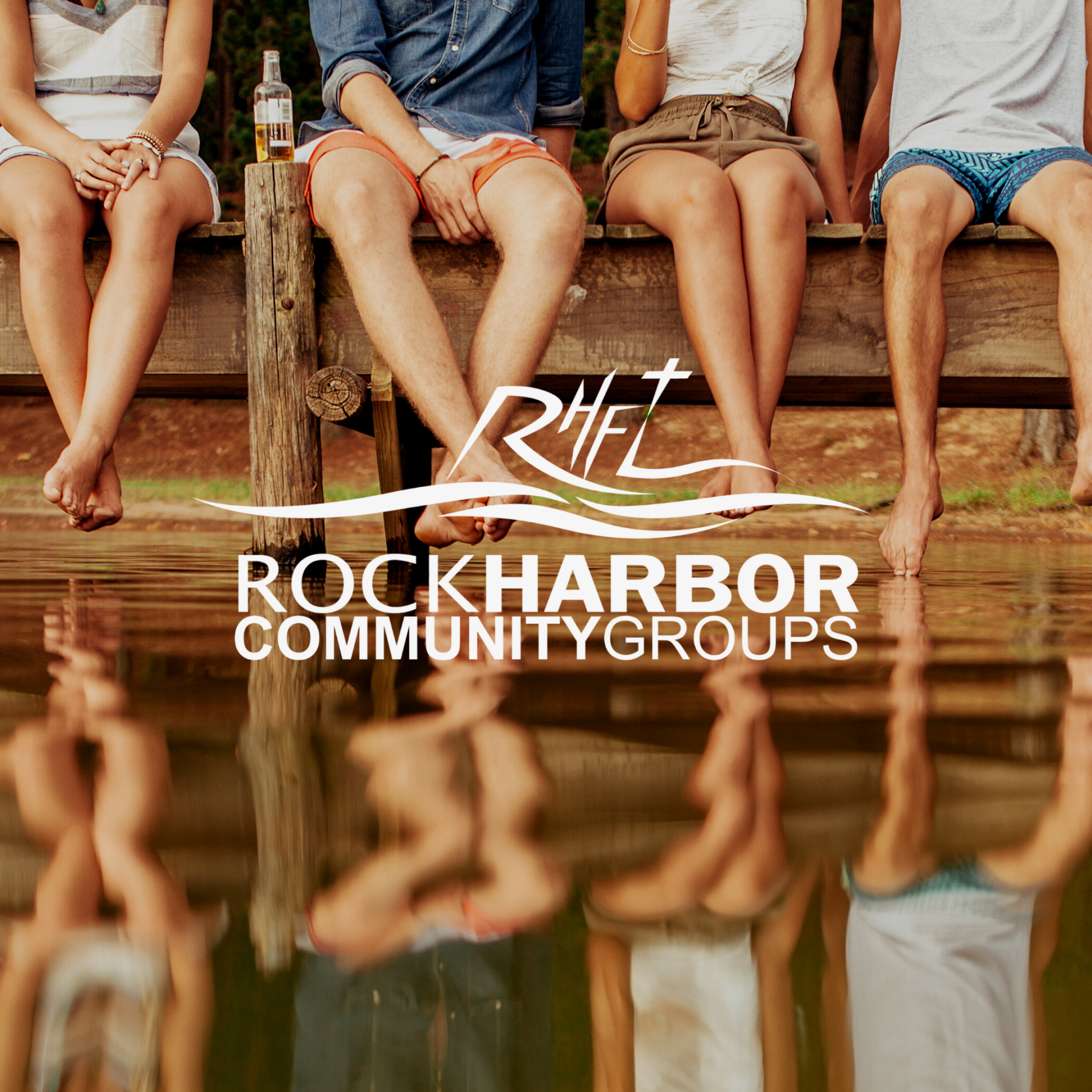 A group of people sitting on a dock with the rockharbor community groups logo