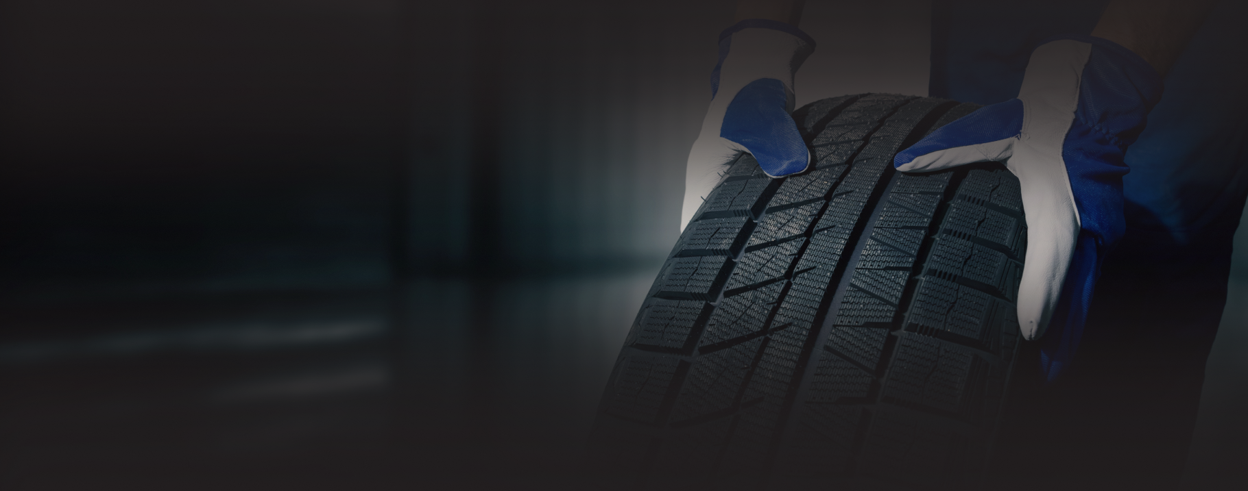 A white car in a garage | Power Tire