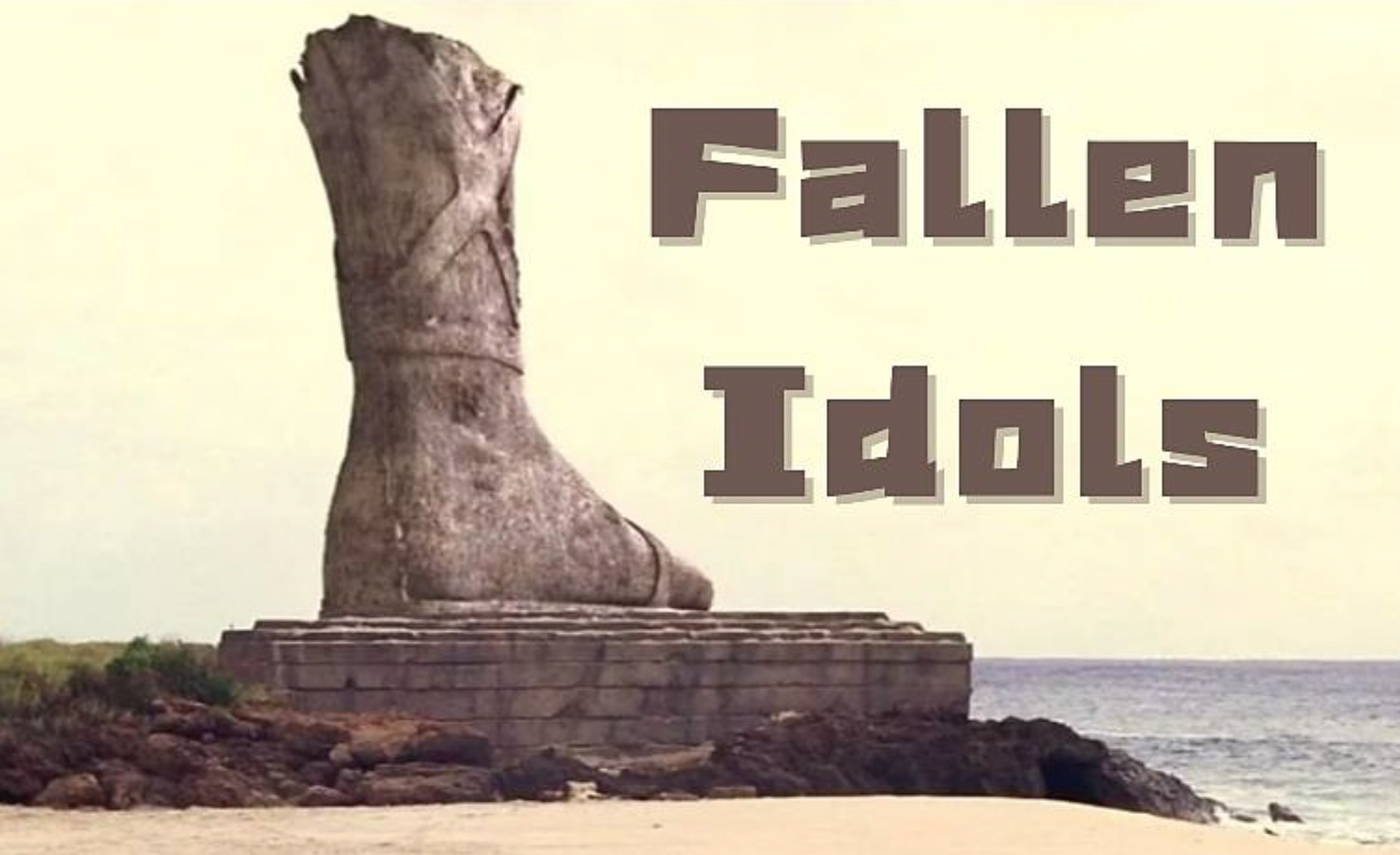 Giant stone statue of a foot, broken off from its body. Text reads: 