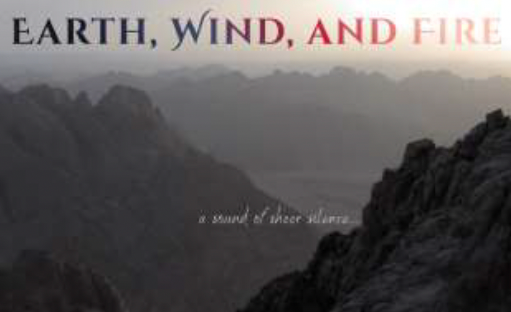 A foggy mountain scene that says 'a sound of sheer silence'