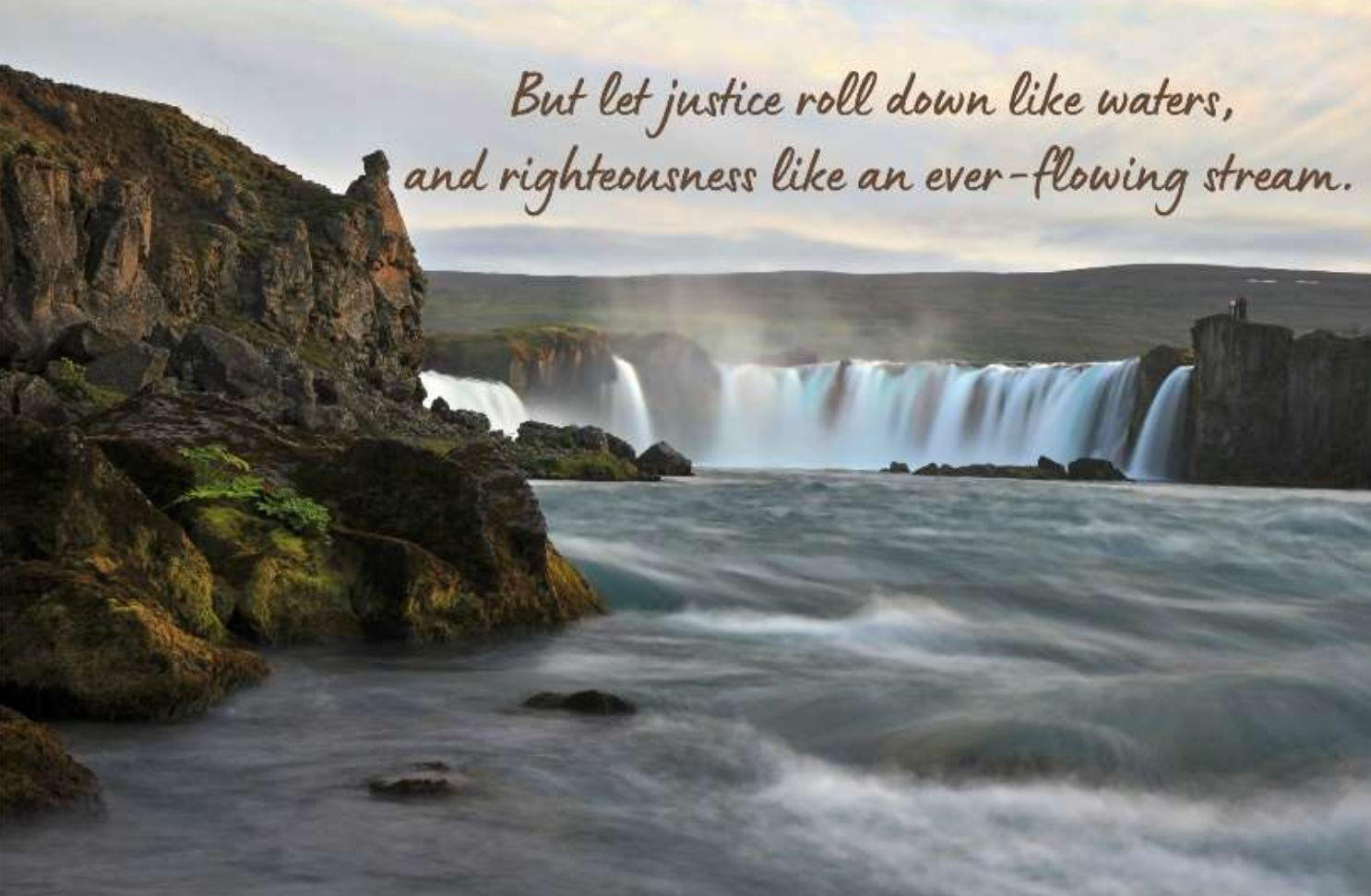 A giant waterfall with water roaring down