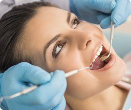 woman receiving dental care; same day treatment