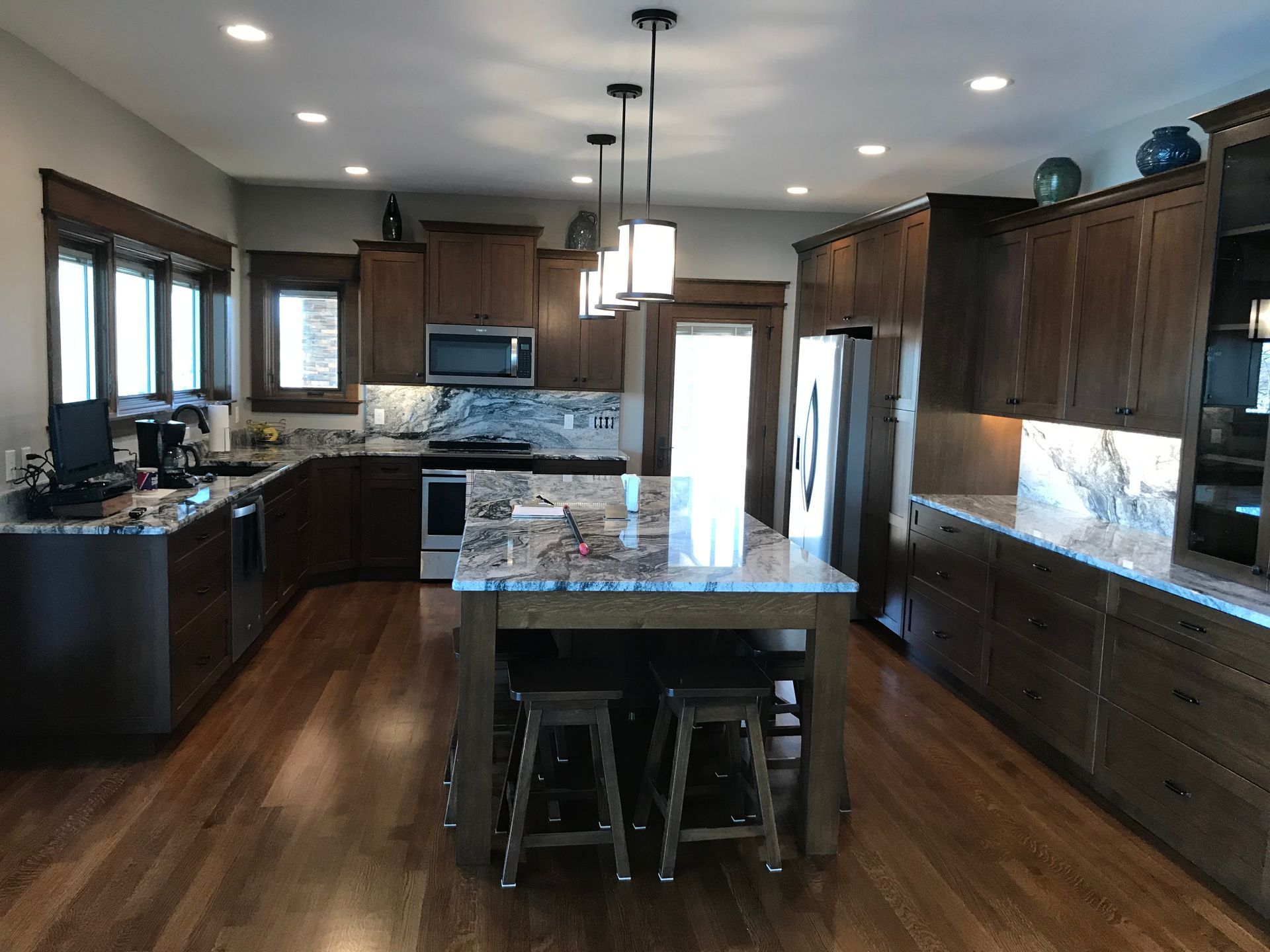 A large kitchen with a large island in the middle
