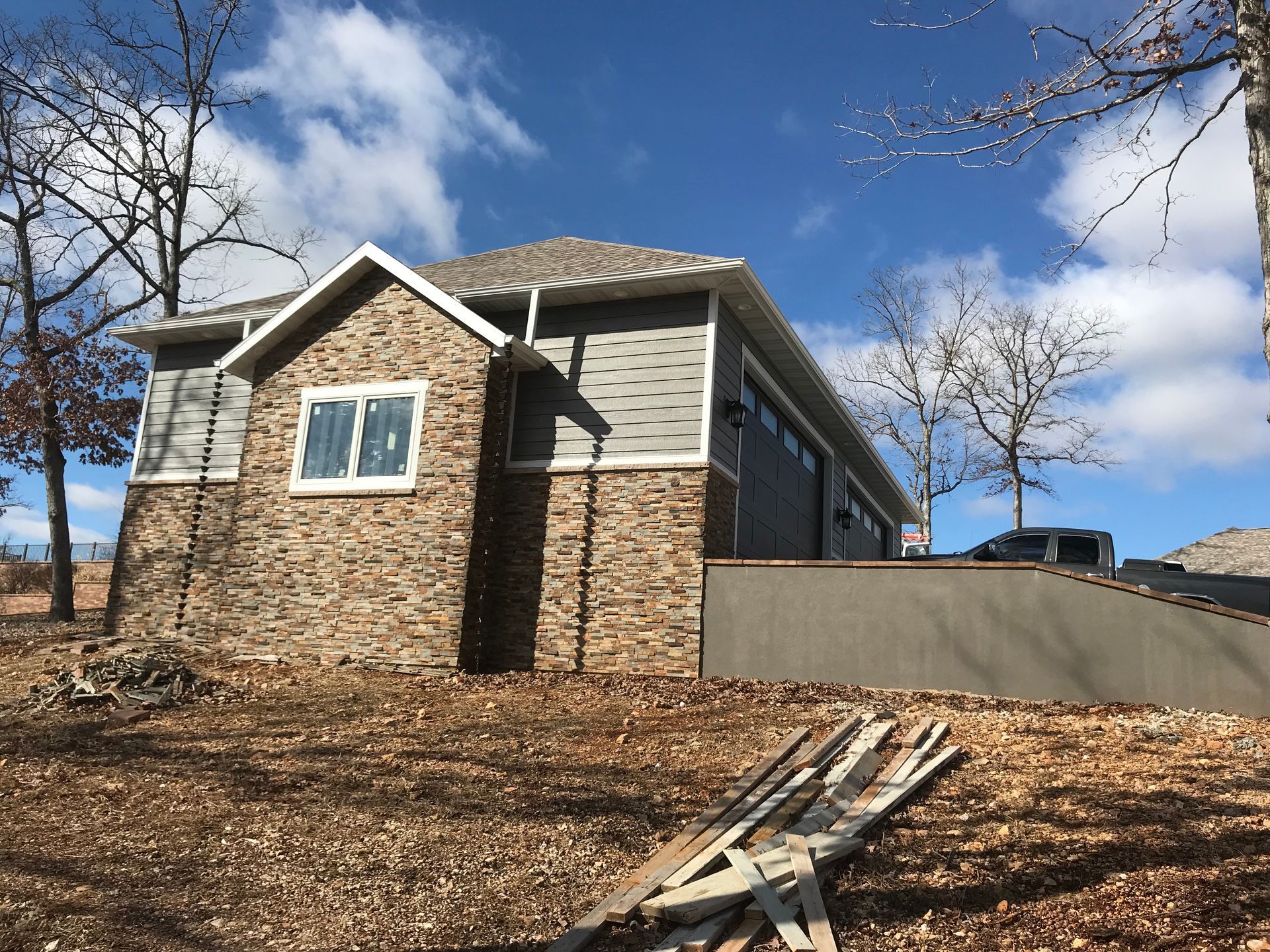 A house is being built in the middle of a field.