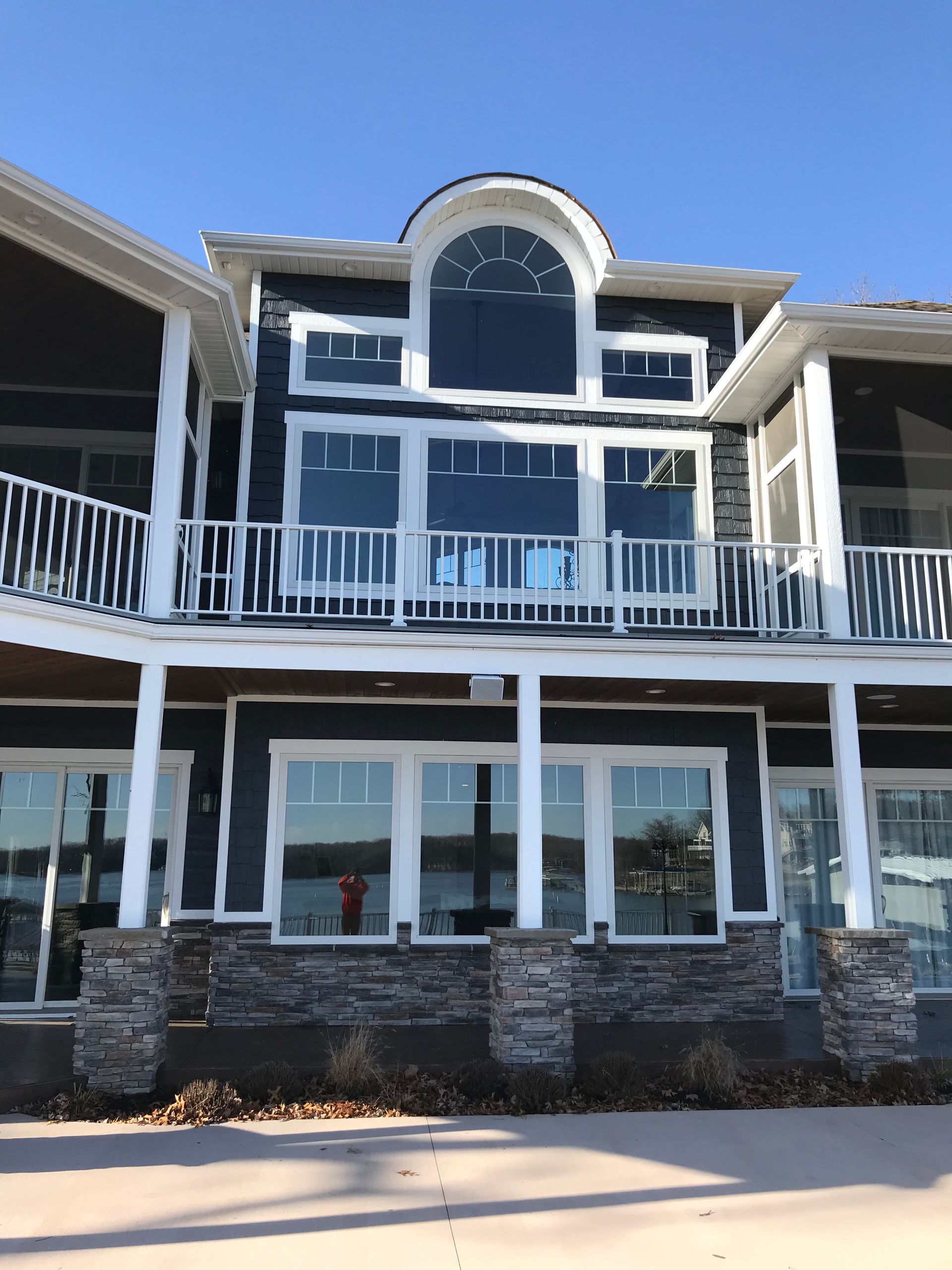 A large house with a lot of windows and a balcony