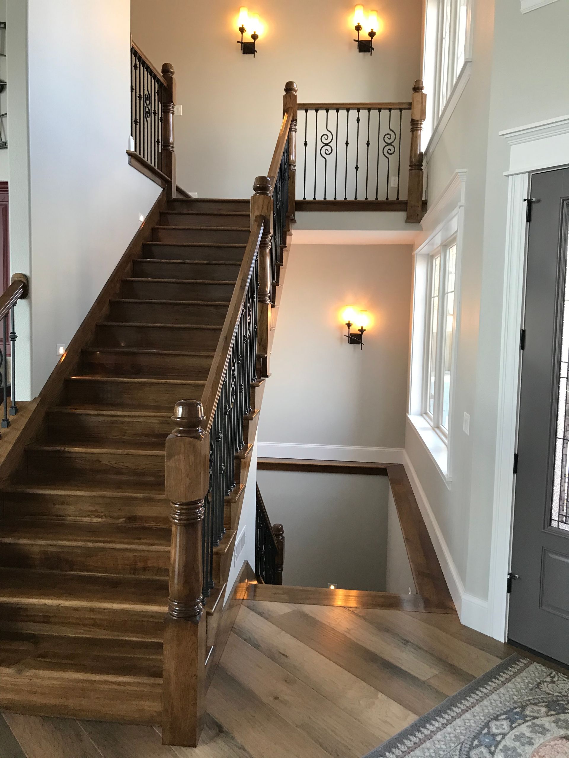 A wooden staircase leading up to the second floor of a house.