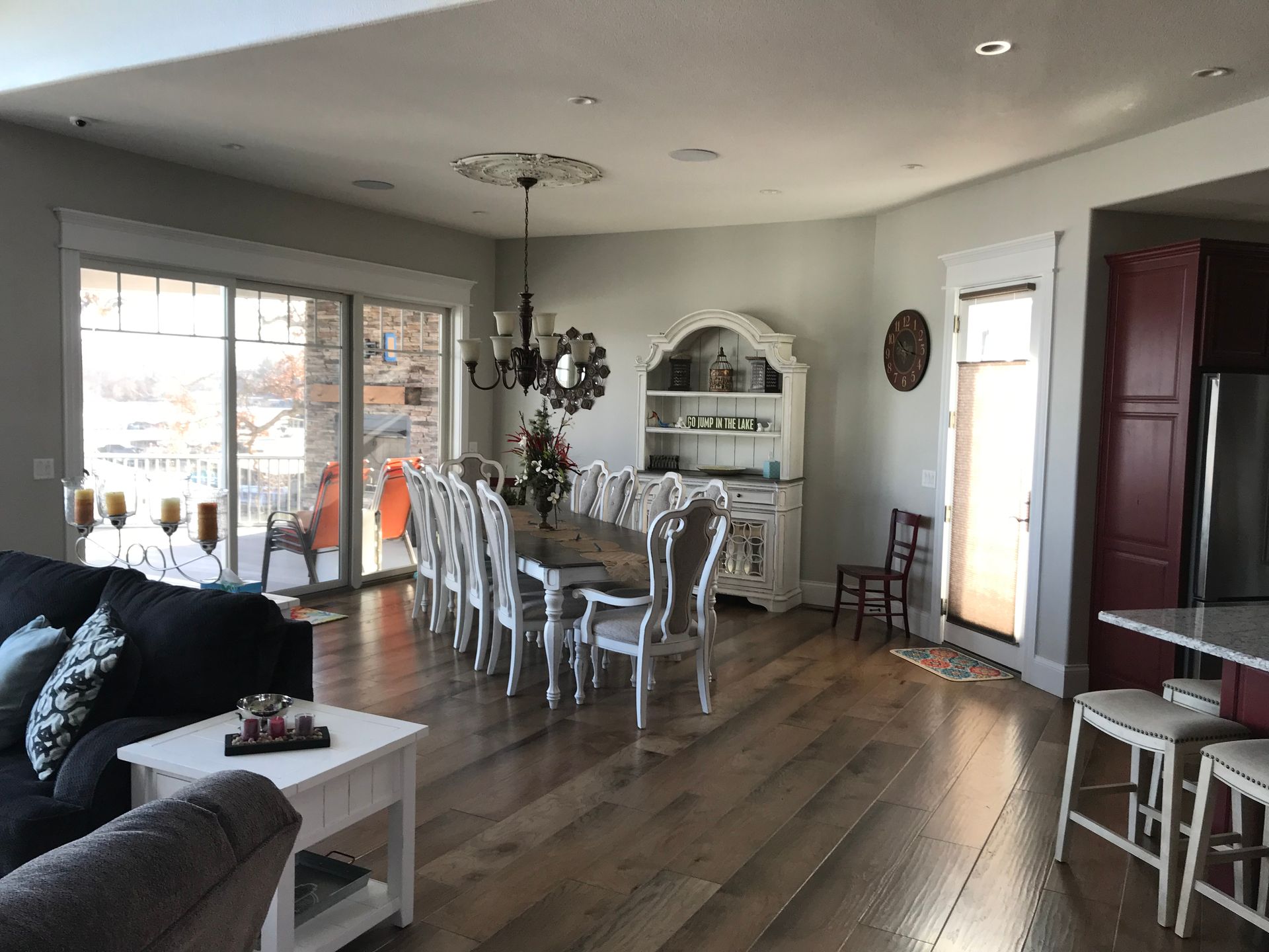 A living room with a dining room table and chairs and a couch.
