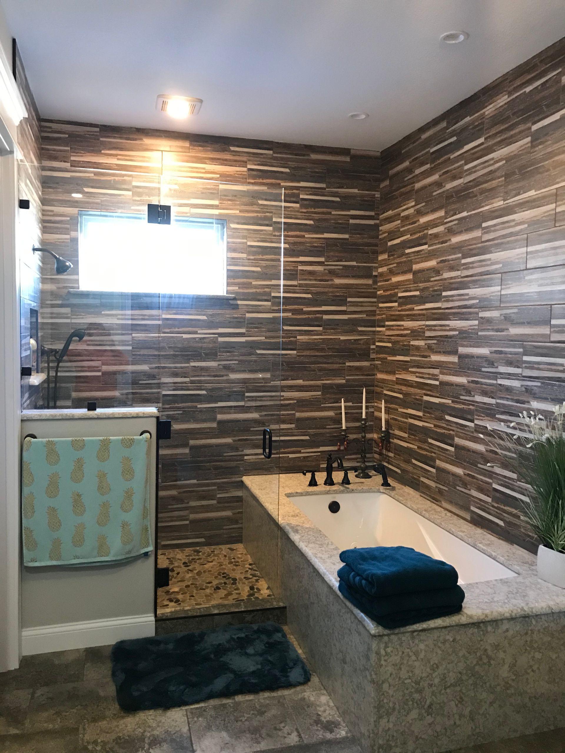 A bathroom with a bathtub and a shower.