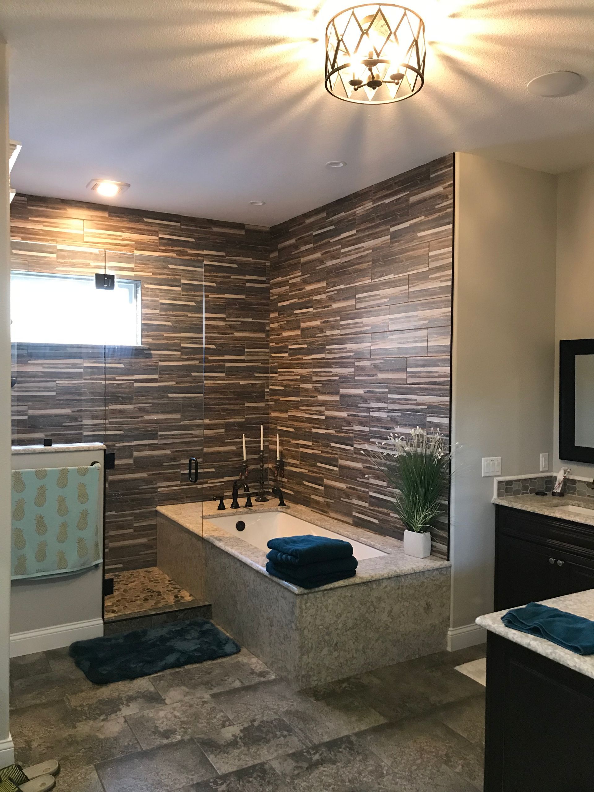 A bathroom with a bathtub and a walk in shower.