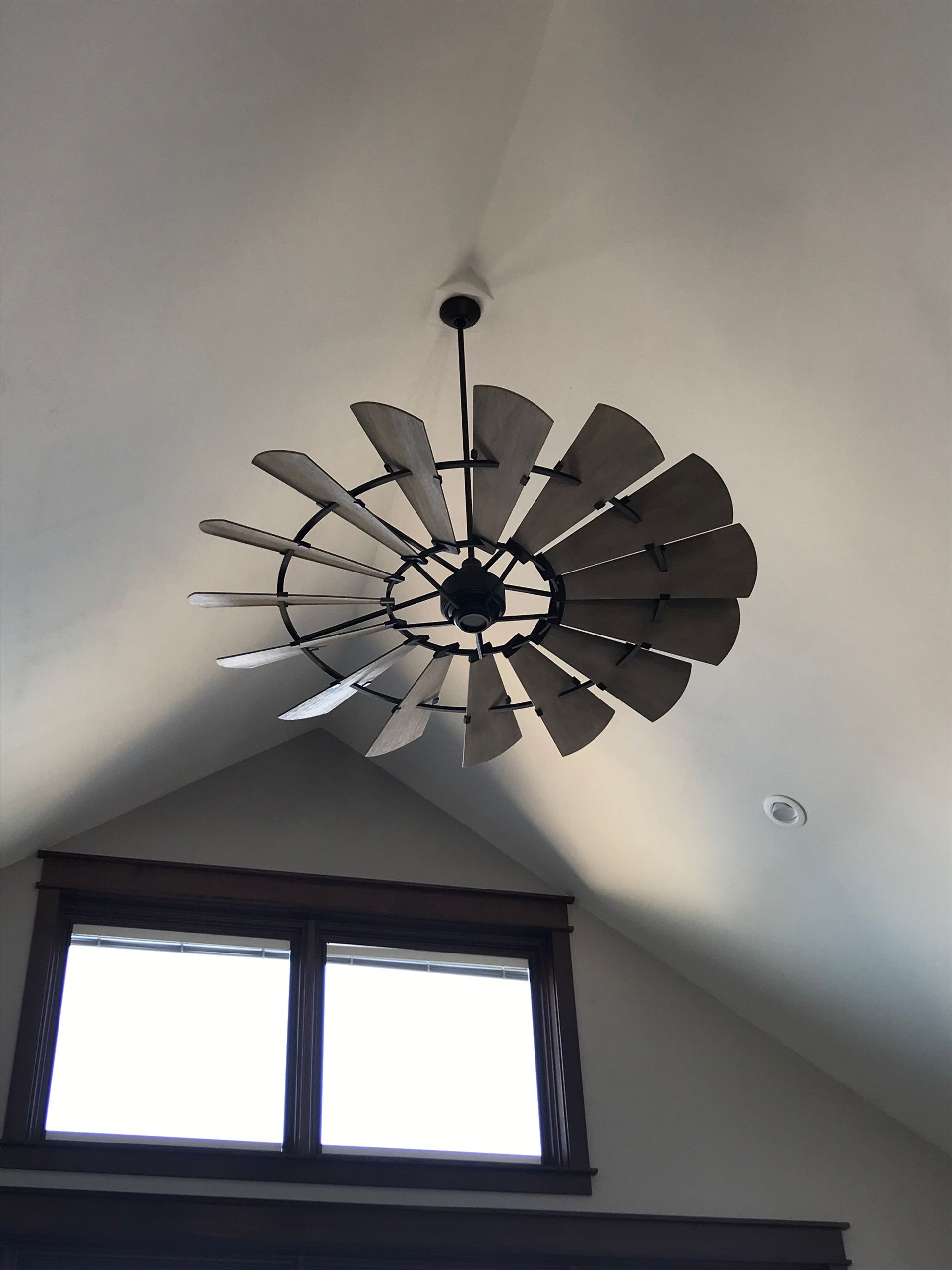 A ceiling fan in the shape of a windmill