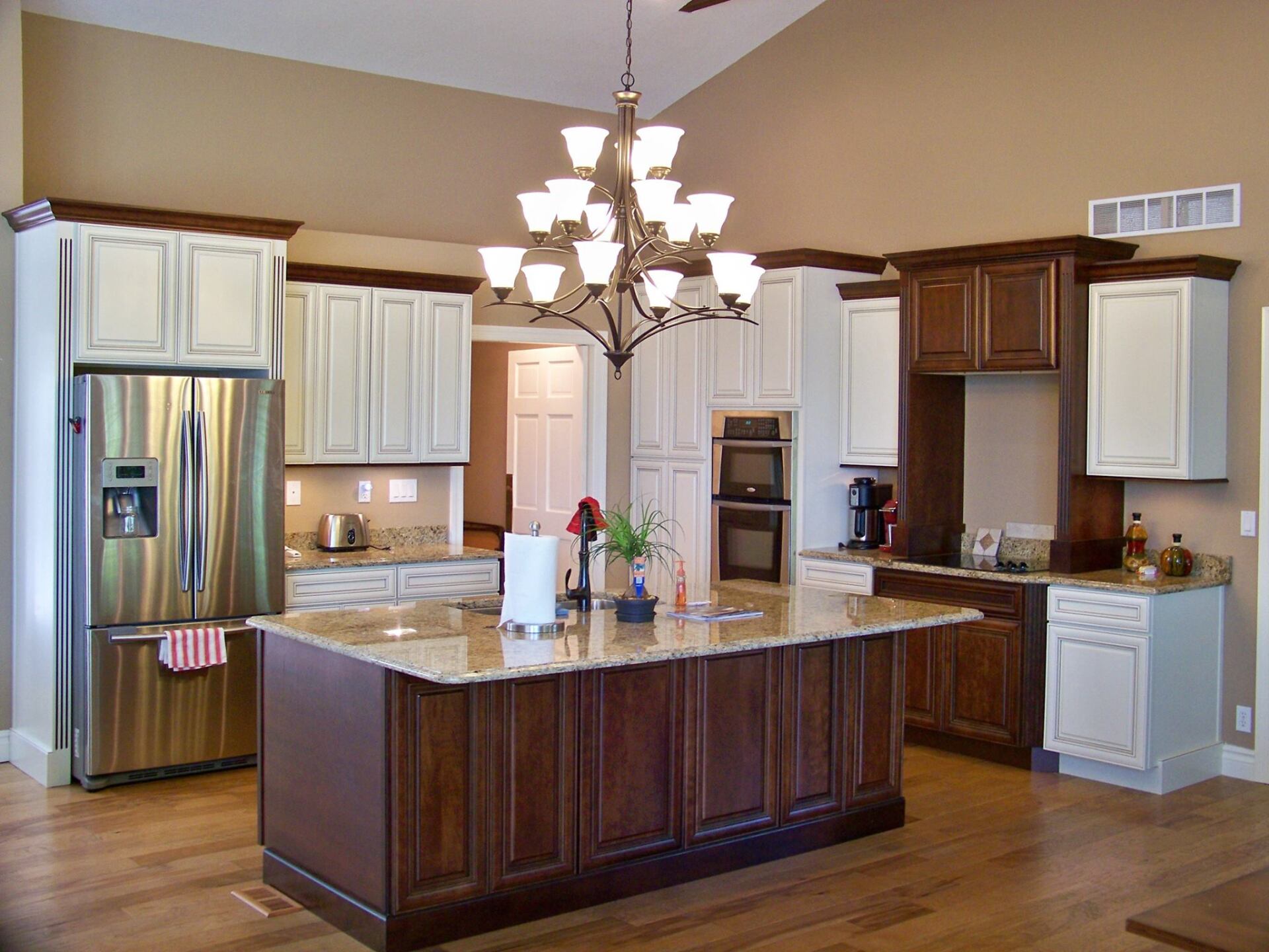 A kitchen with a large island and stainless steel appliances