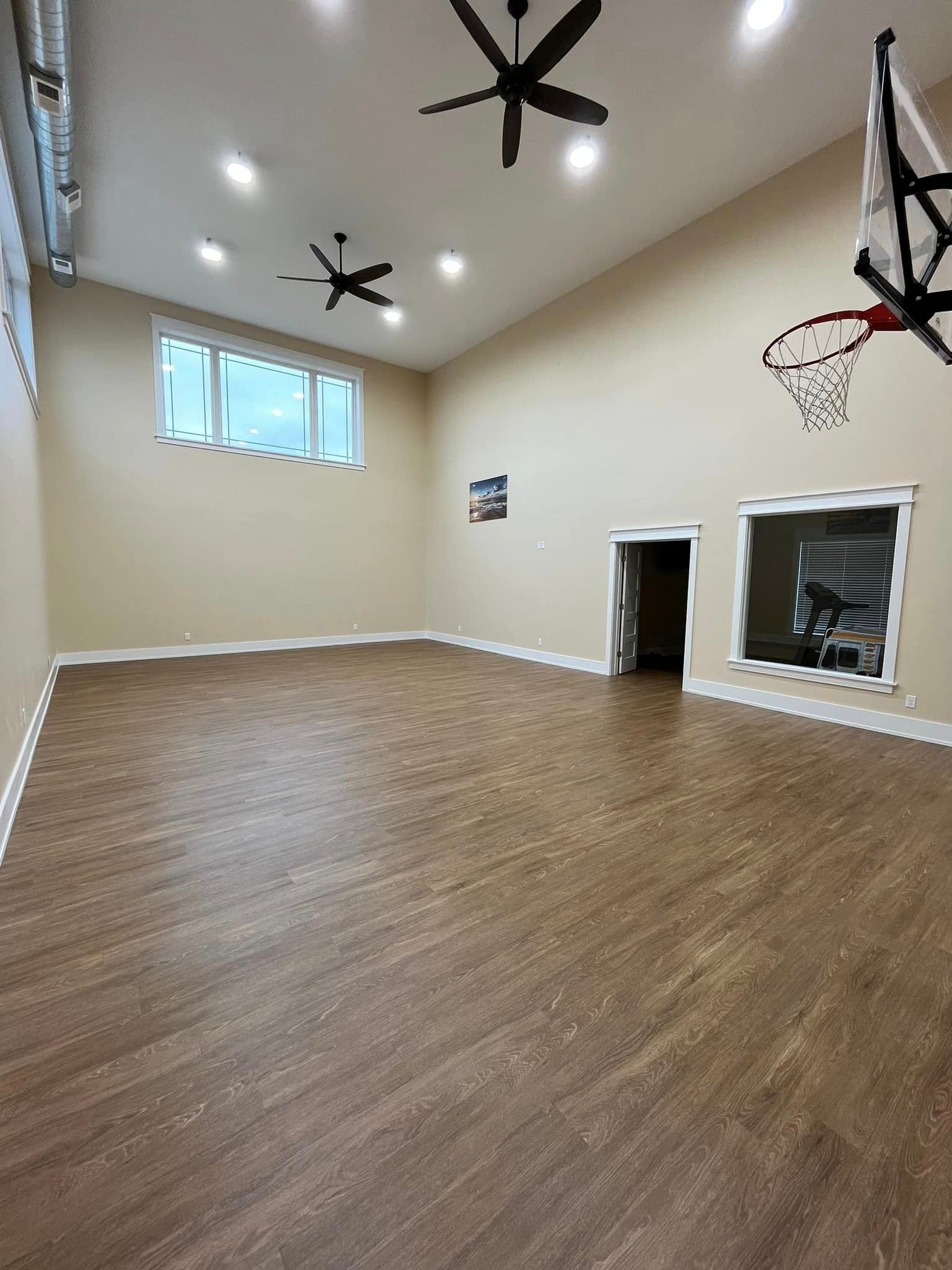 There is a basketball hoop in the middle of the room.