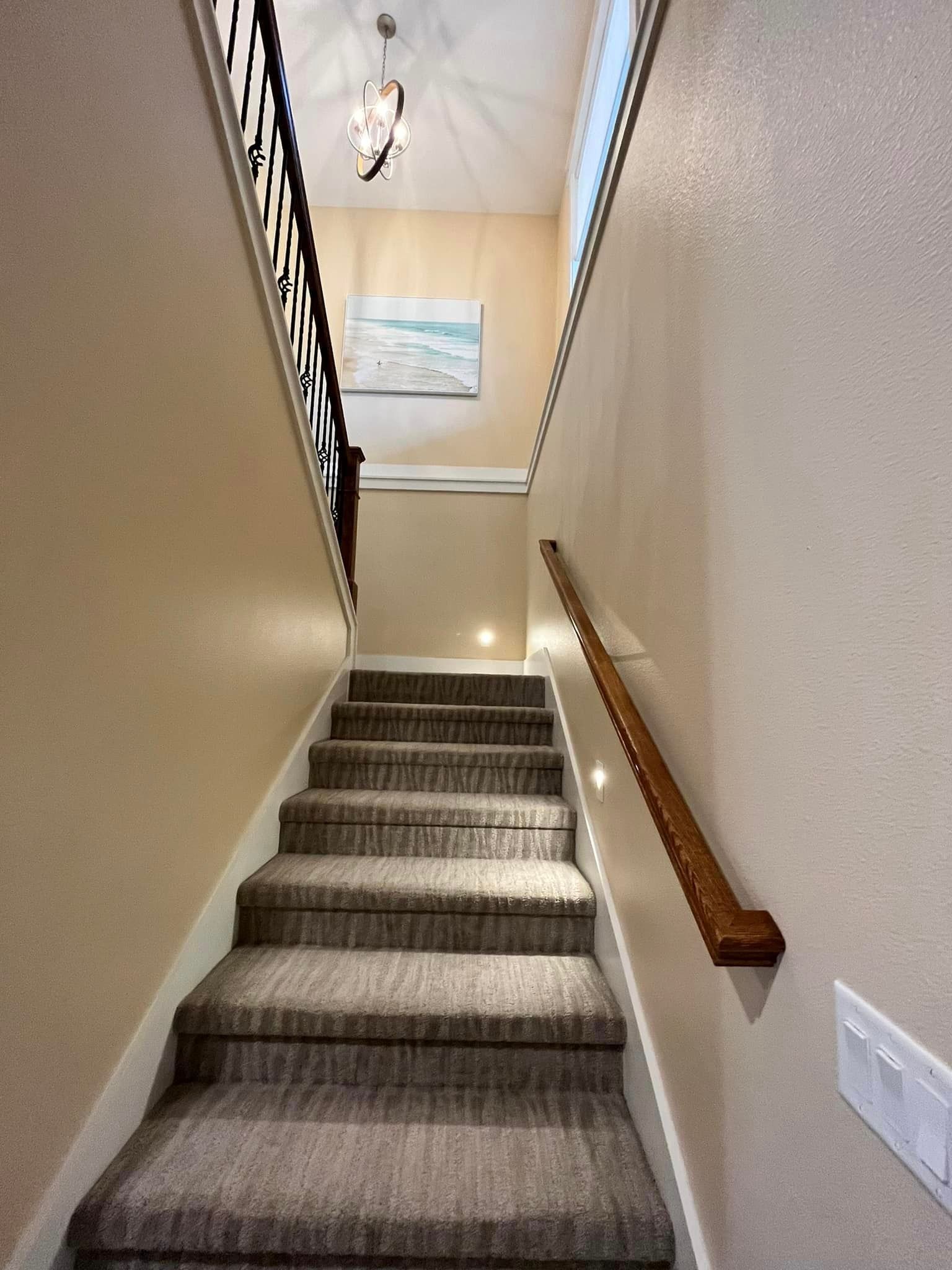 A set of stairs leading up to the second floor of a house.