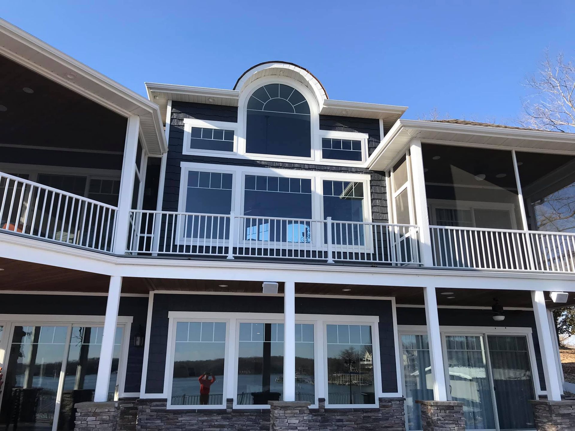 A large house with a balcony and a lot of windows.