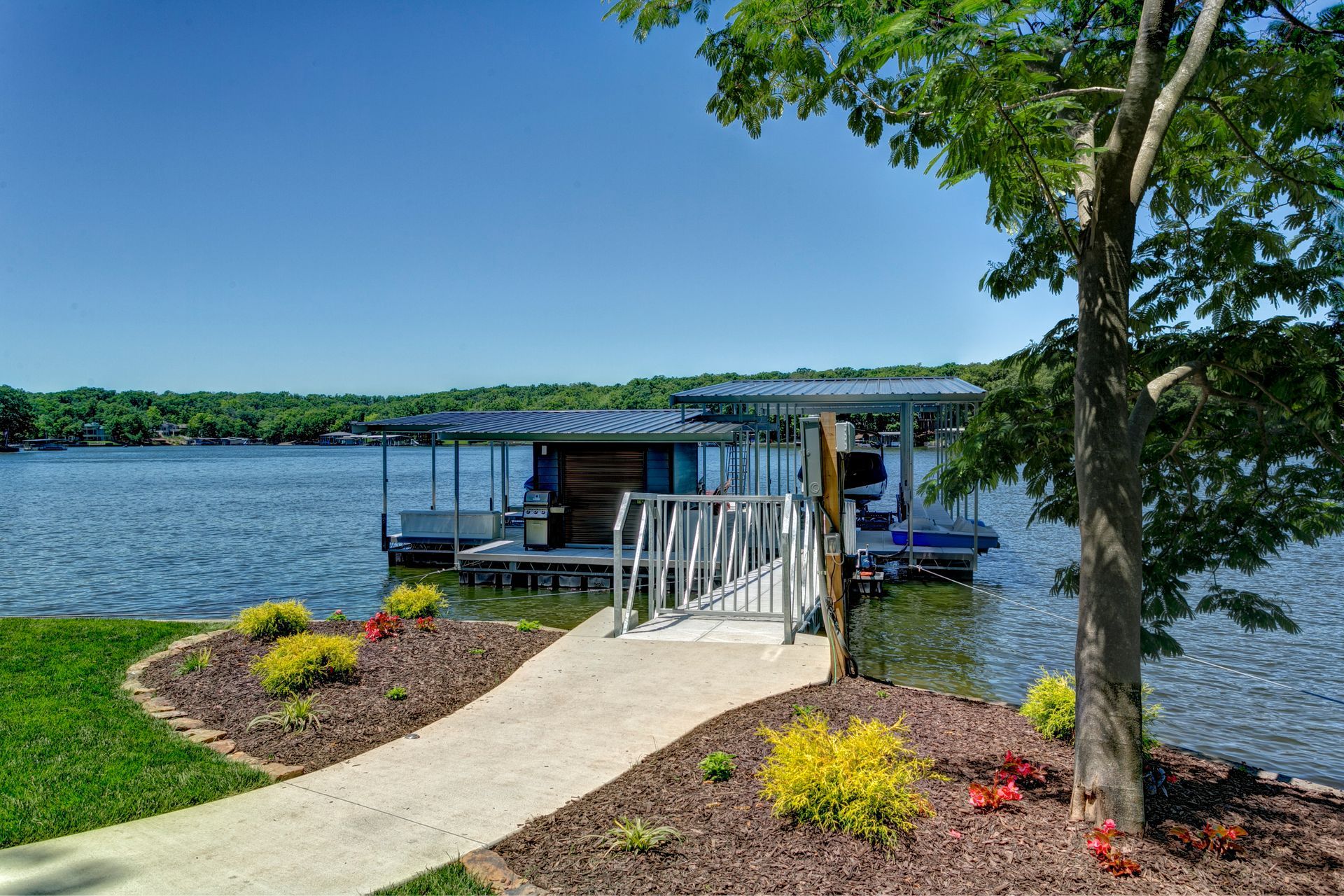 A boat is docked at a dock on a lake.