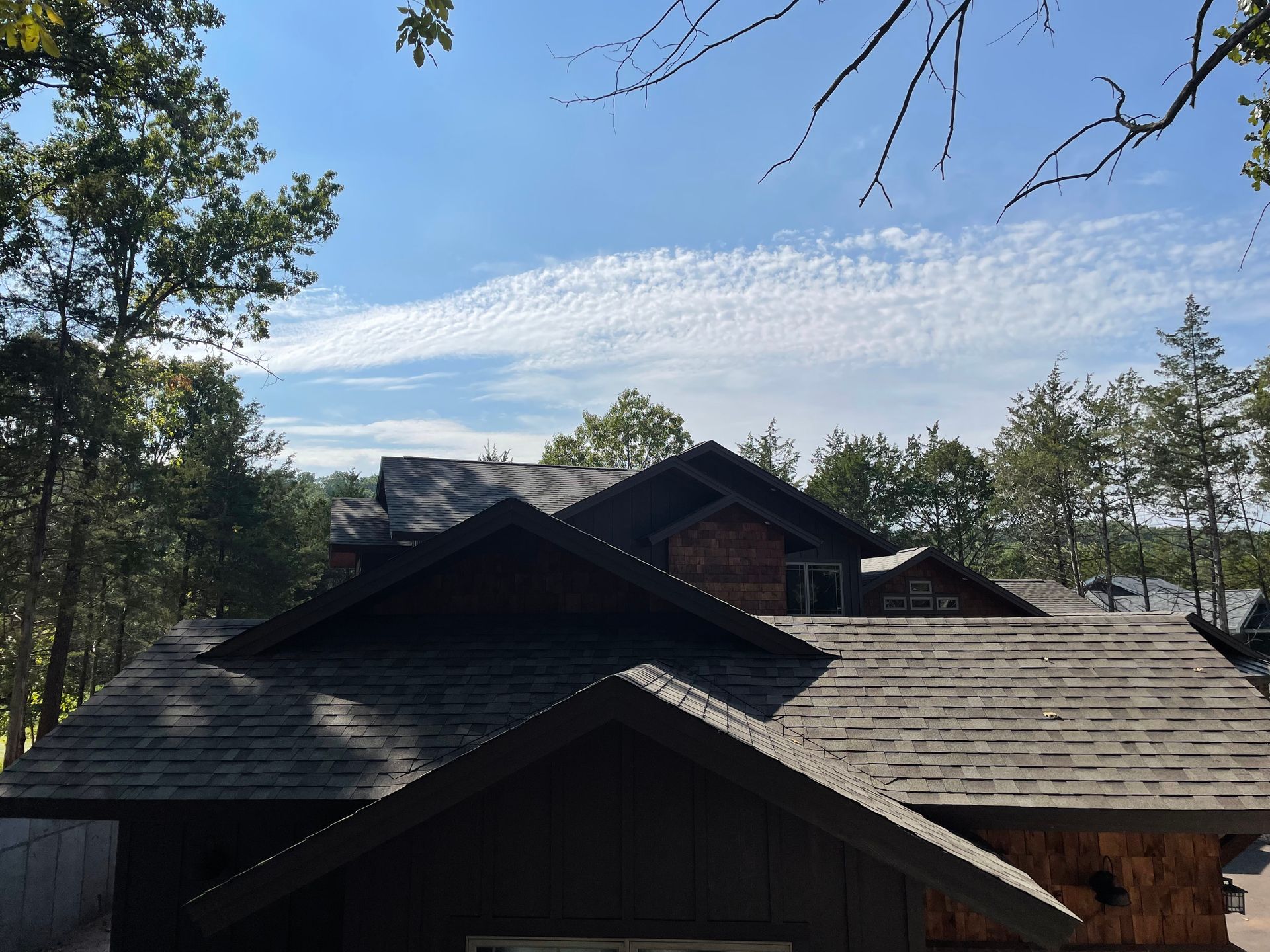A house with a roof that has shingles on it