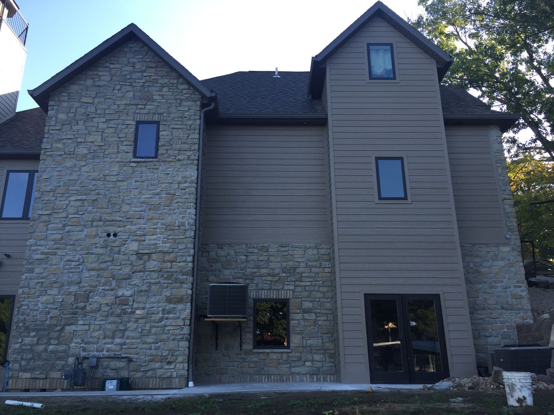 A large house with a lot of windows on it