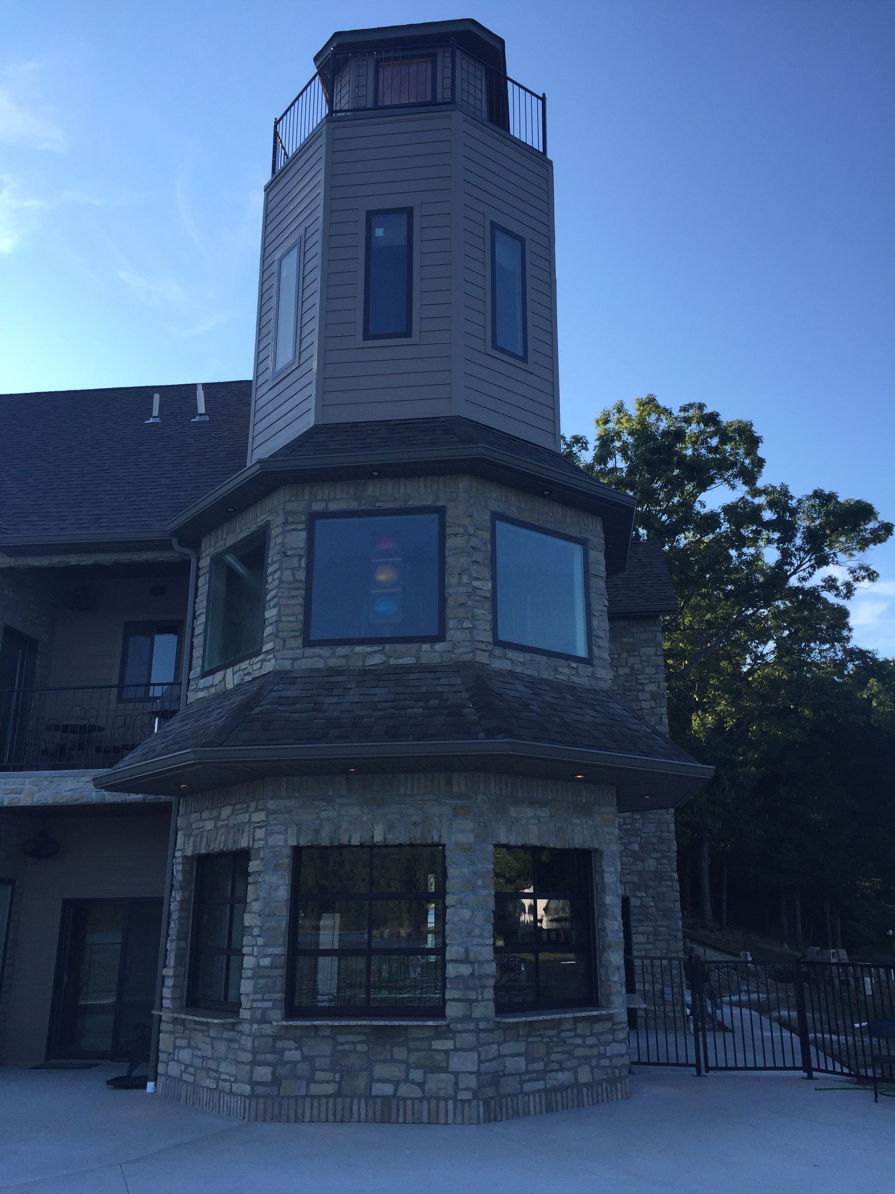 A large brick building with a lighthouse on top of it