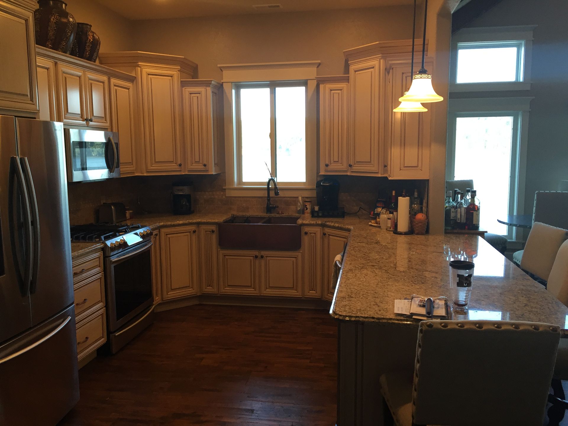 A kitchen with stainless steel appliances and granite counter tops