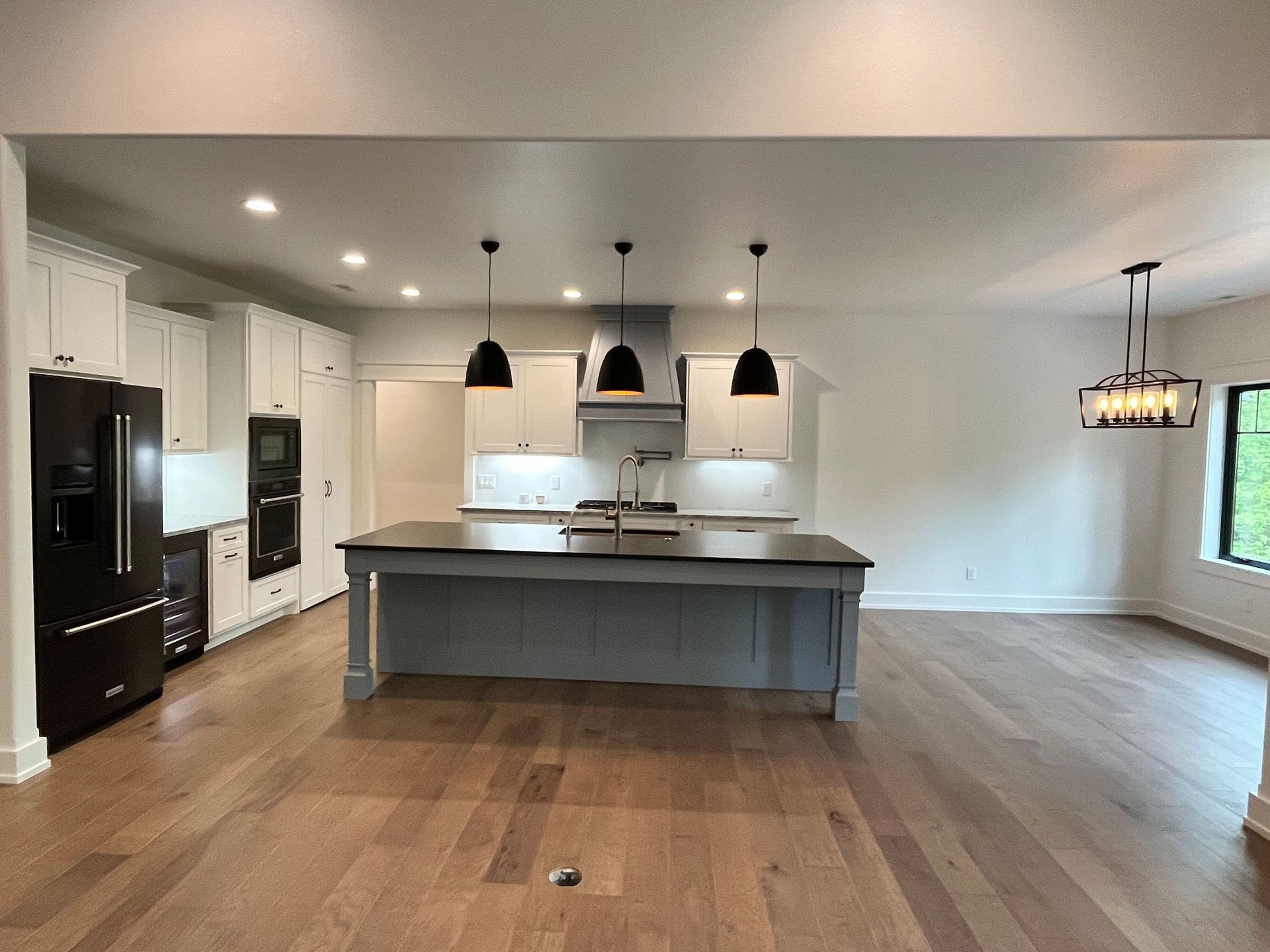 There is a large island in the middle of the kitchen.