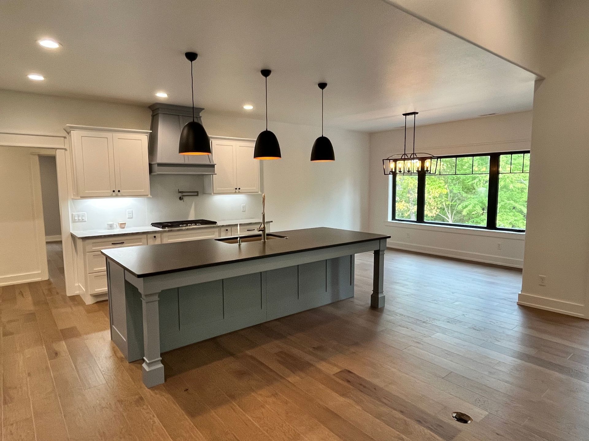 There is a large island in the middle of the kitchen.